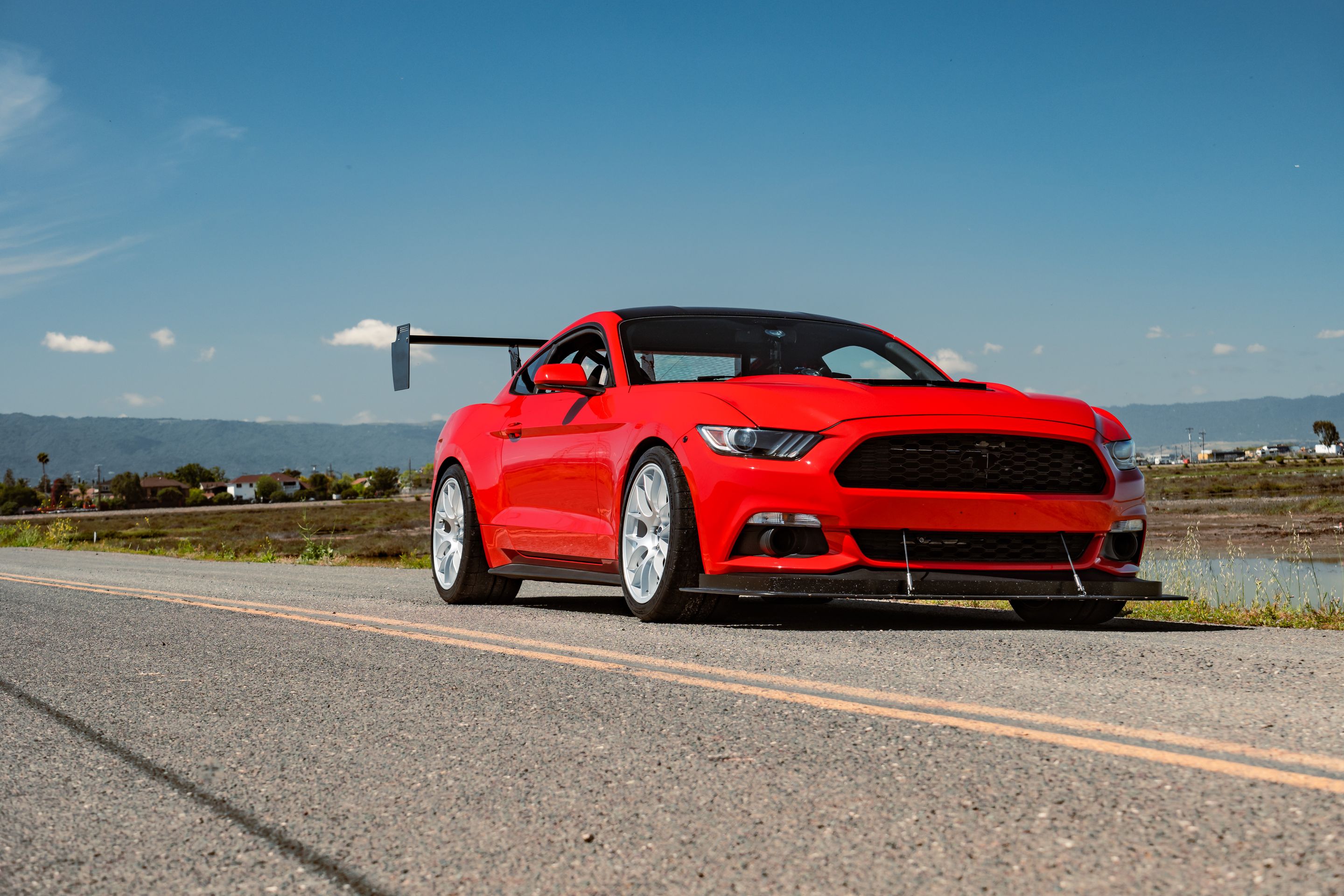 Red Ford S550 Mustang GT with 19" EC-7 Apex wheels in Race Silver