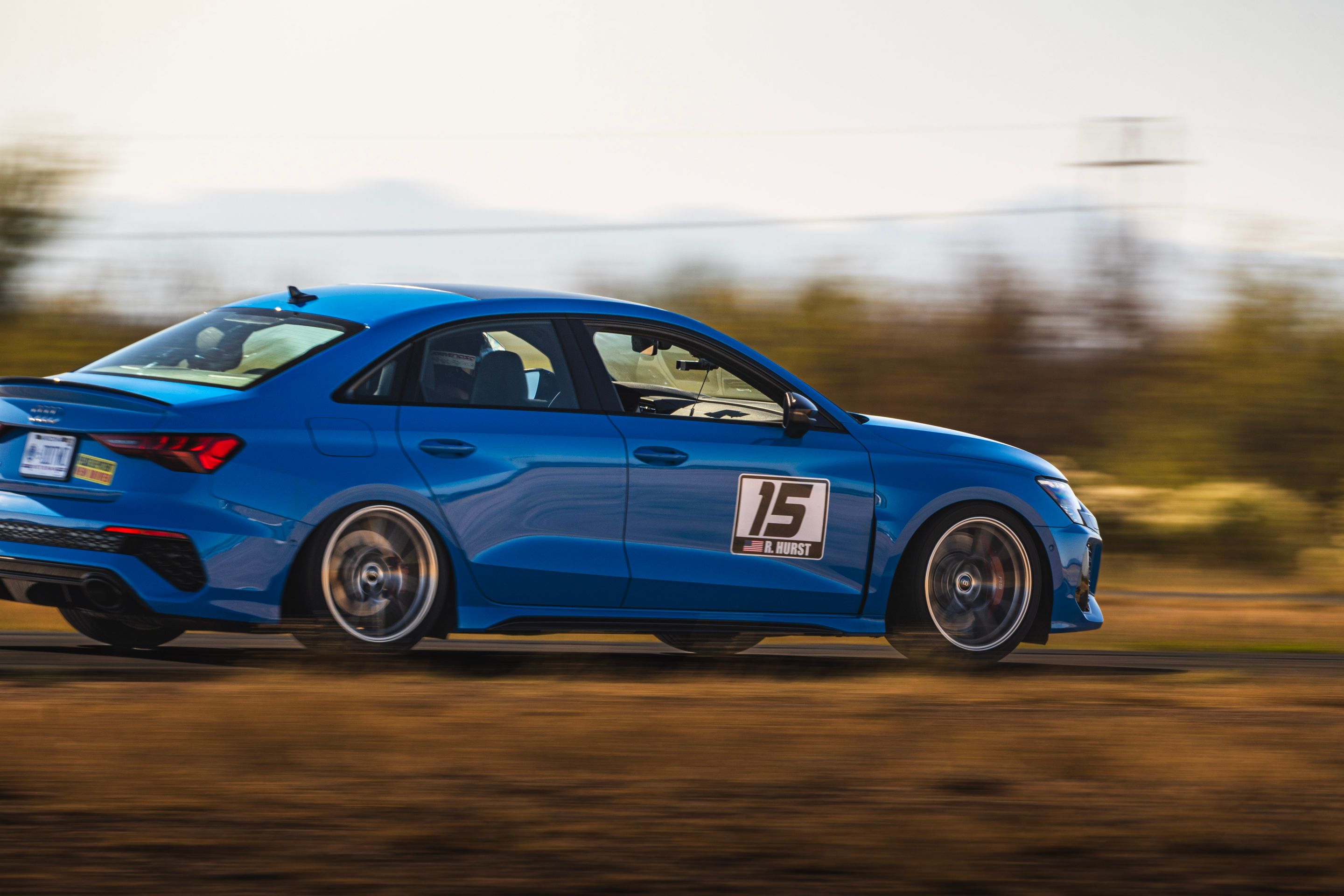Blue Audi 8Y RS 3 with 18" VS-5RS Apex wheels in Brushed Clear