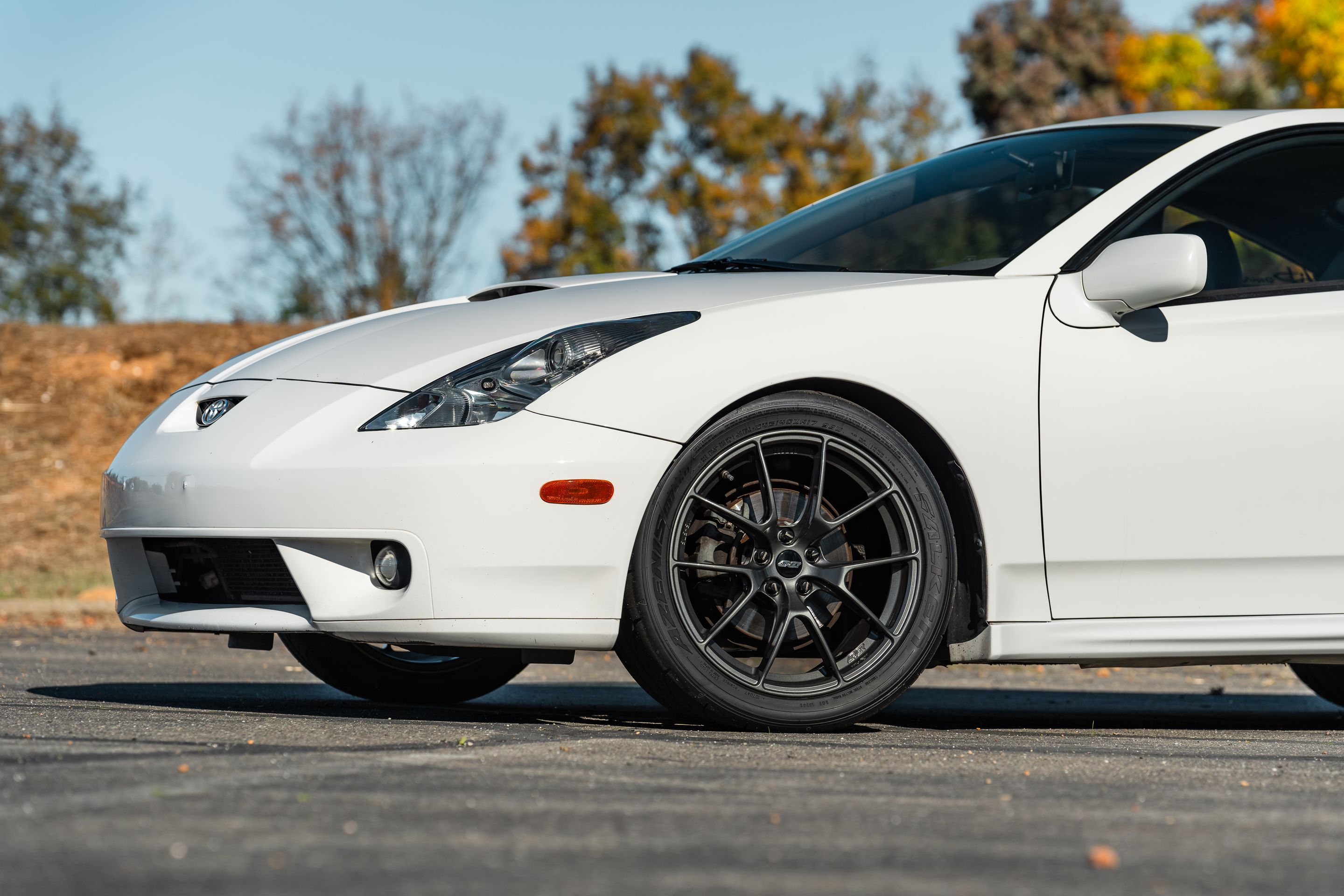 White Toyota 7th Gen Celica with 17" VS-5RS Apex wheels in Anthracite