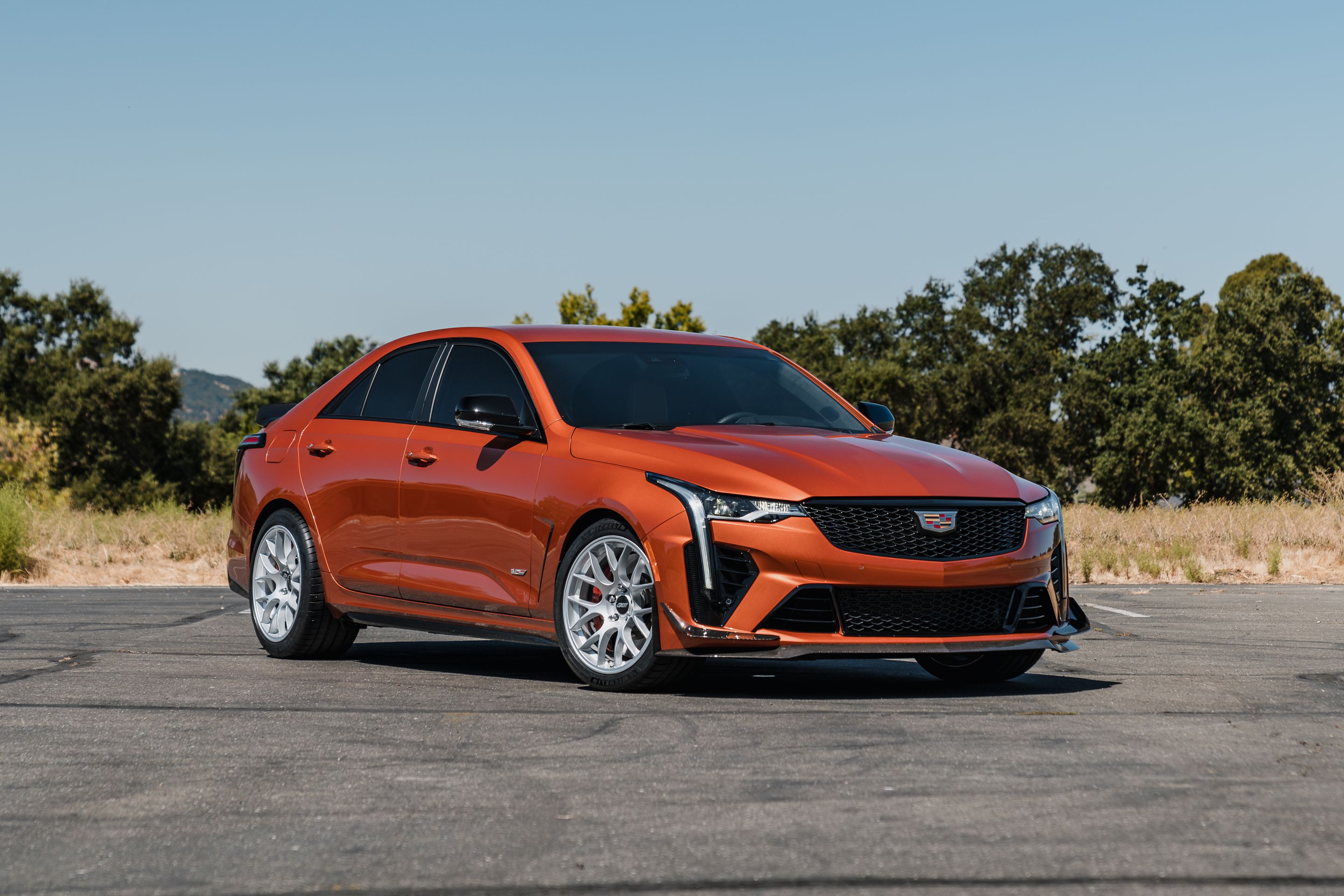 Orange Cadillac CT4-V Blackwing with 18" EC-7 Apex wheels in Race Silver