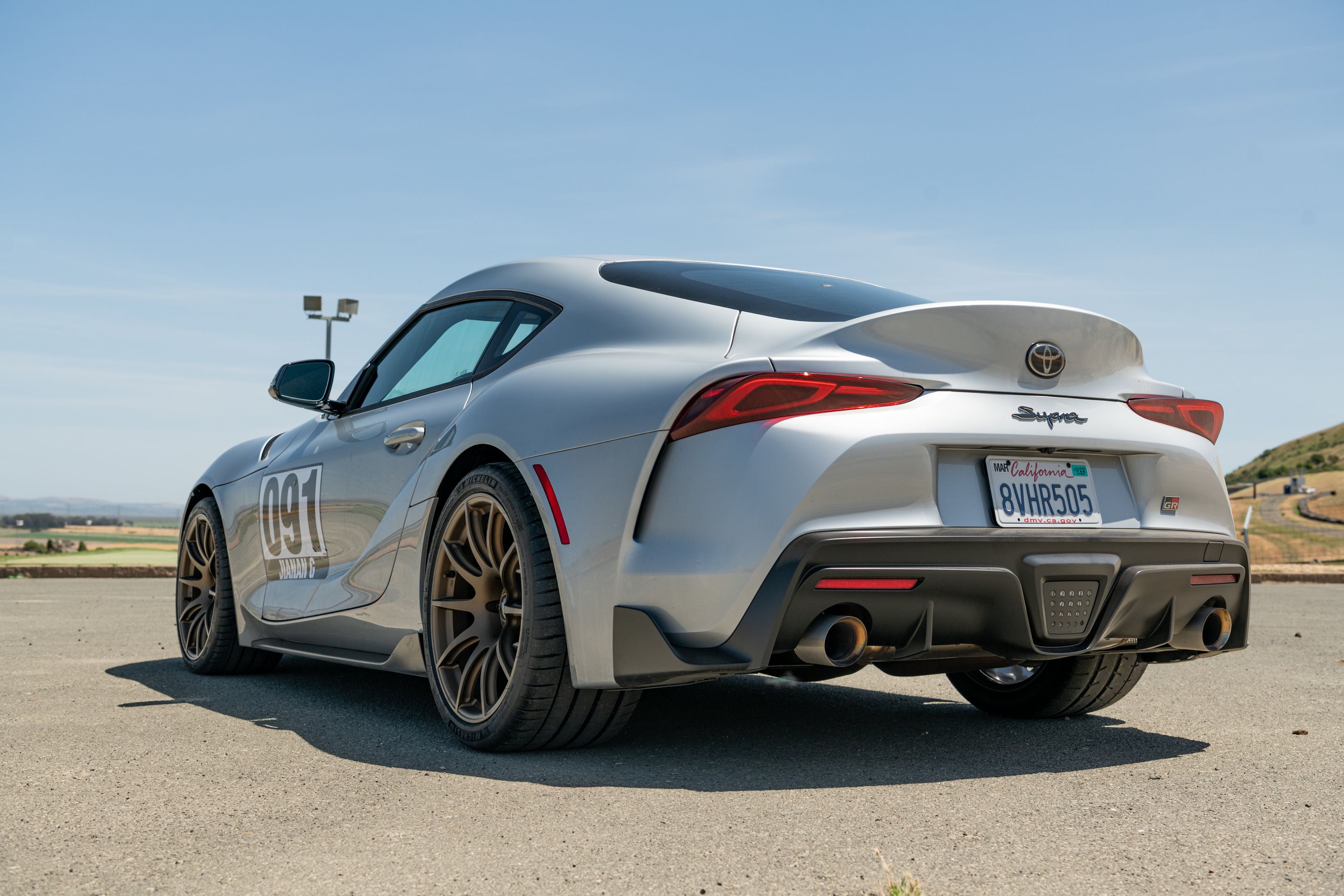 Silver Toyota GR Supra with 19" SM-10 Apex wheels in Satin Bronze