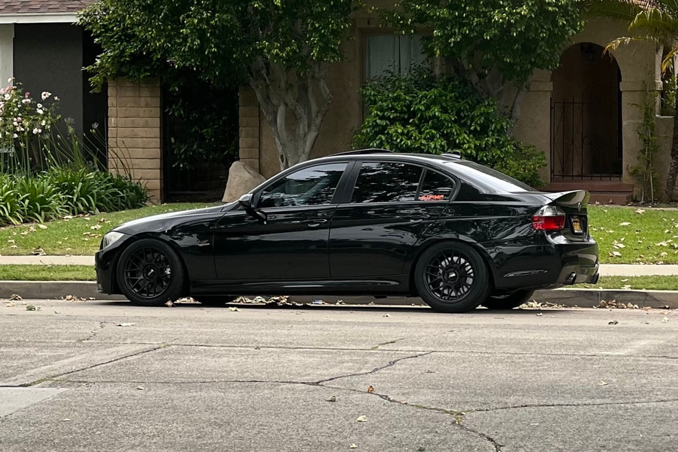 Black BMW E90 Sedan 3 Series with 17" ARC-8 Apex wheels in Satin Black