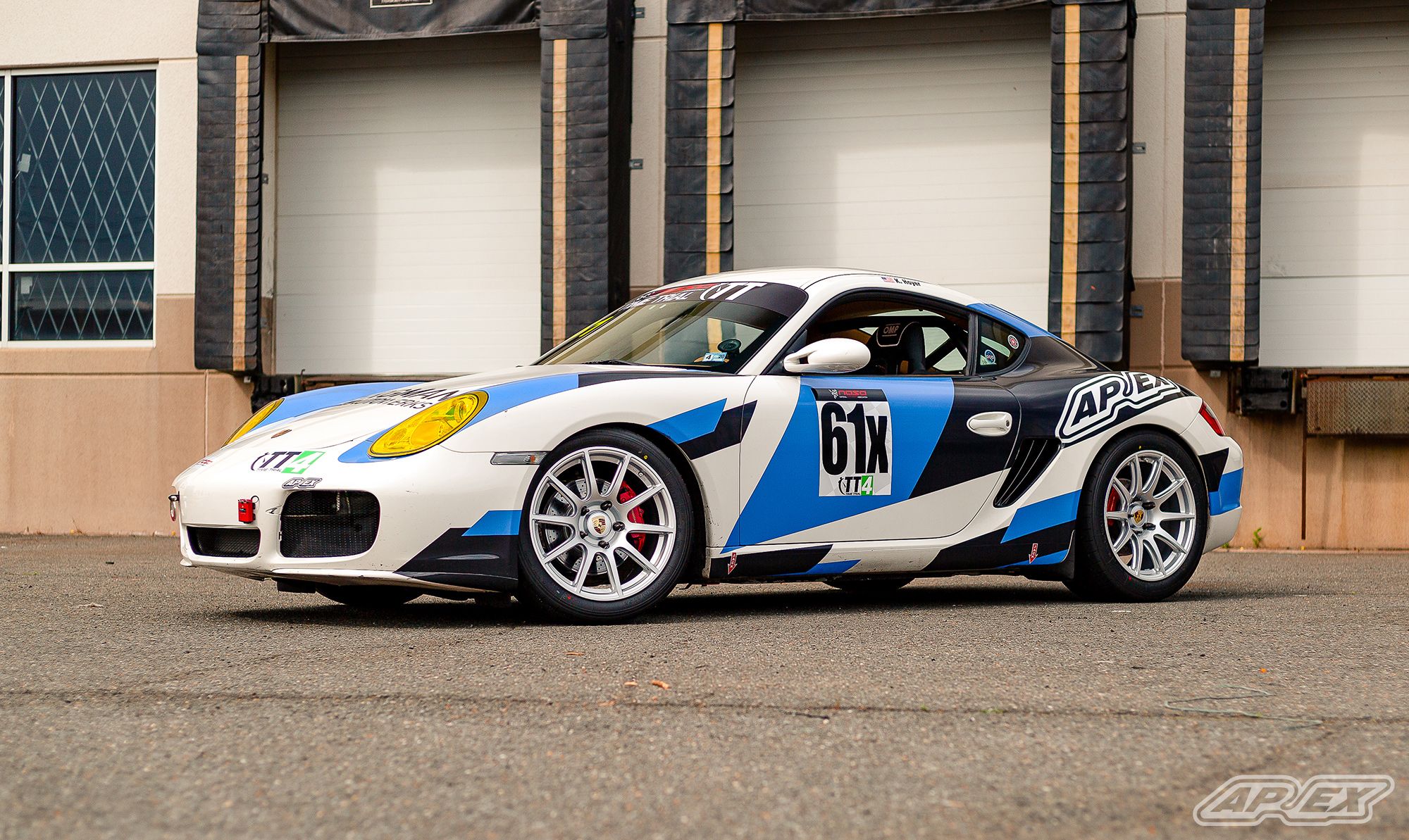 White Porsche 987 Cayman S with 18" SM-10 Apex wheels in Race Silver