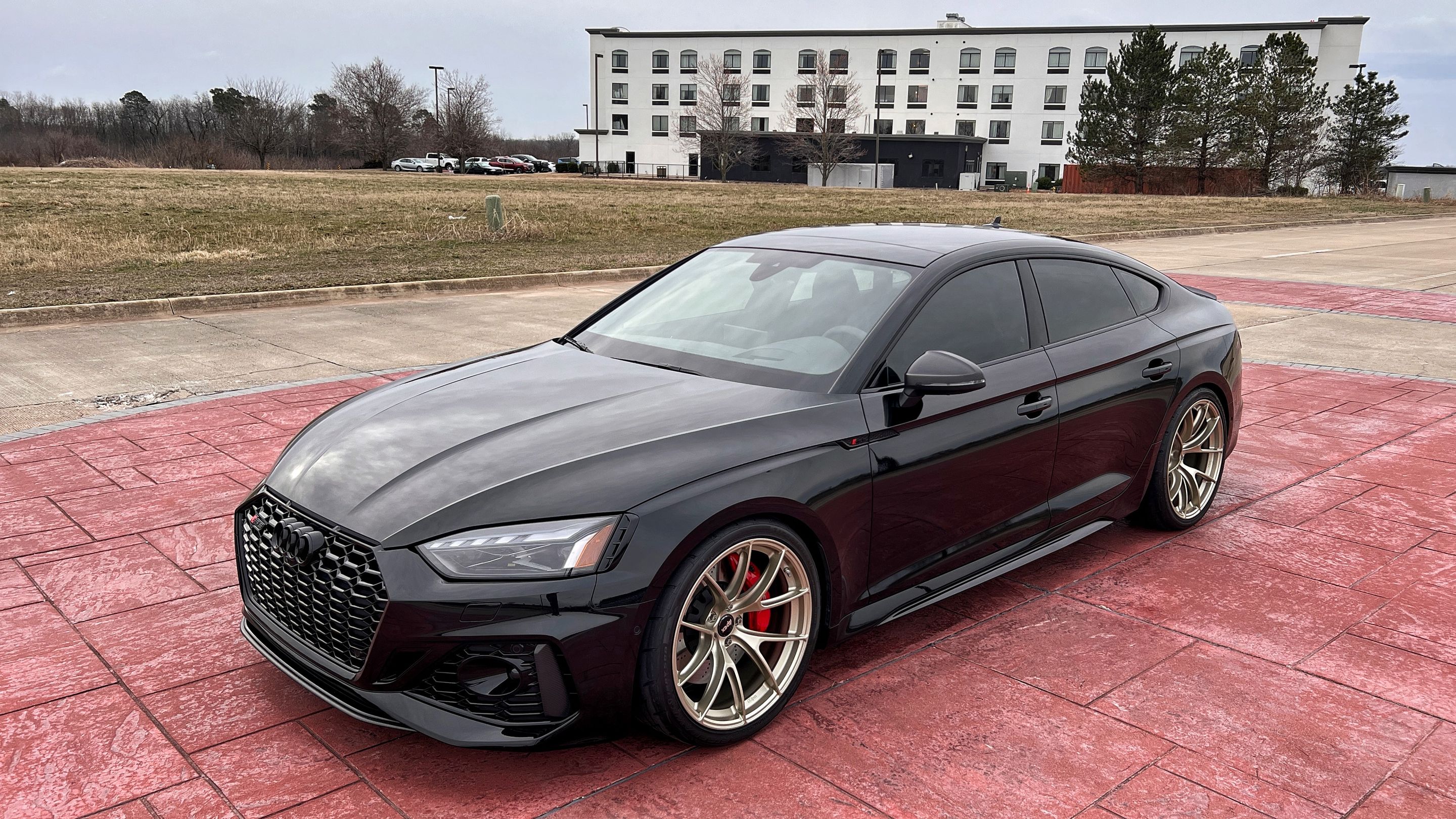 Black Audi B9 RS 5 Sportback with 20" VS-5RS Apex wheels in Motorsport Gold