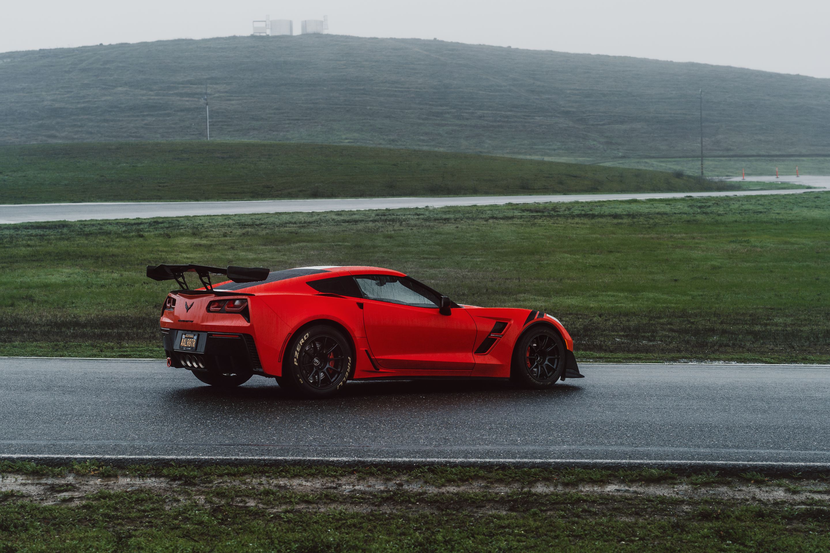 Red Chevrolet C7 Corvette Grand Sport with 18" SM-10RE Apex wheels in Satin Black