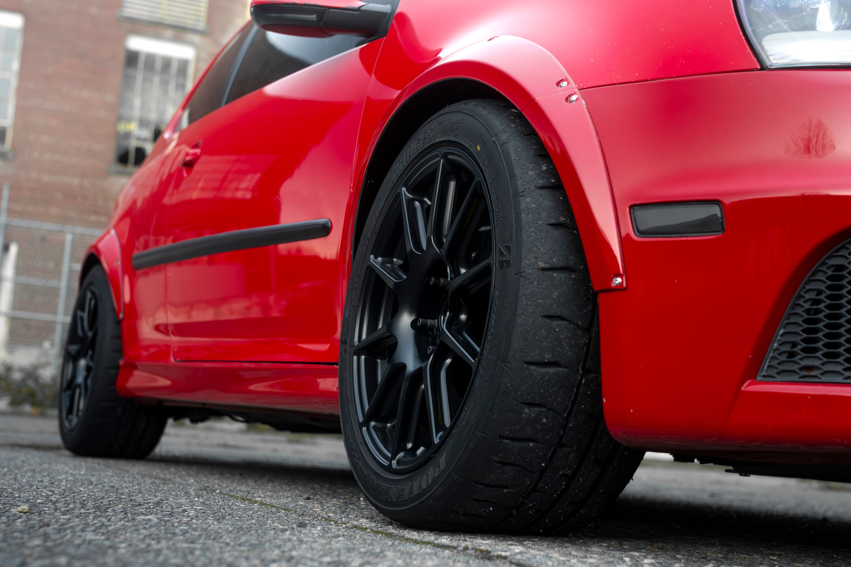 Red VW MK5 Golf with 17" SM-10 Apex wheels in Satin Black