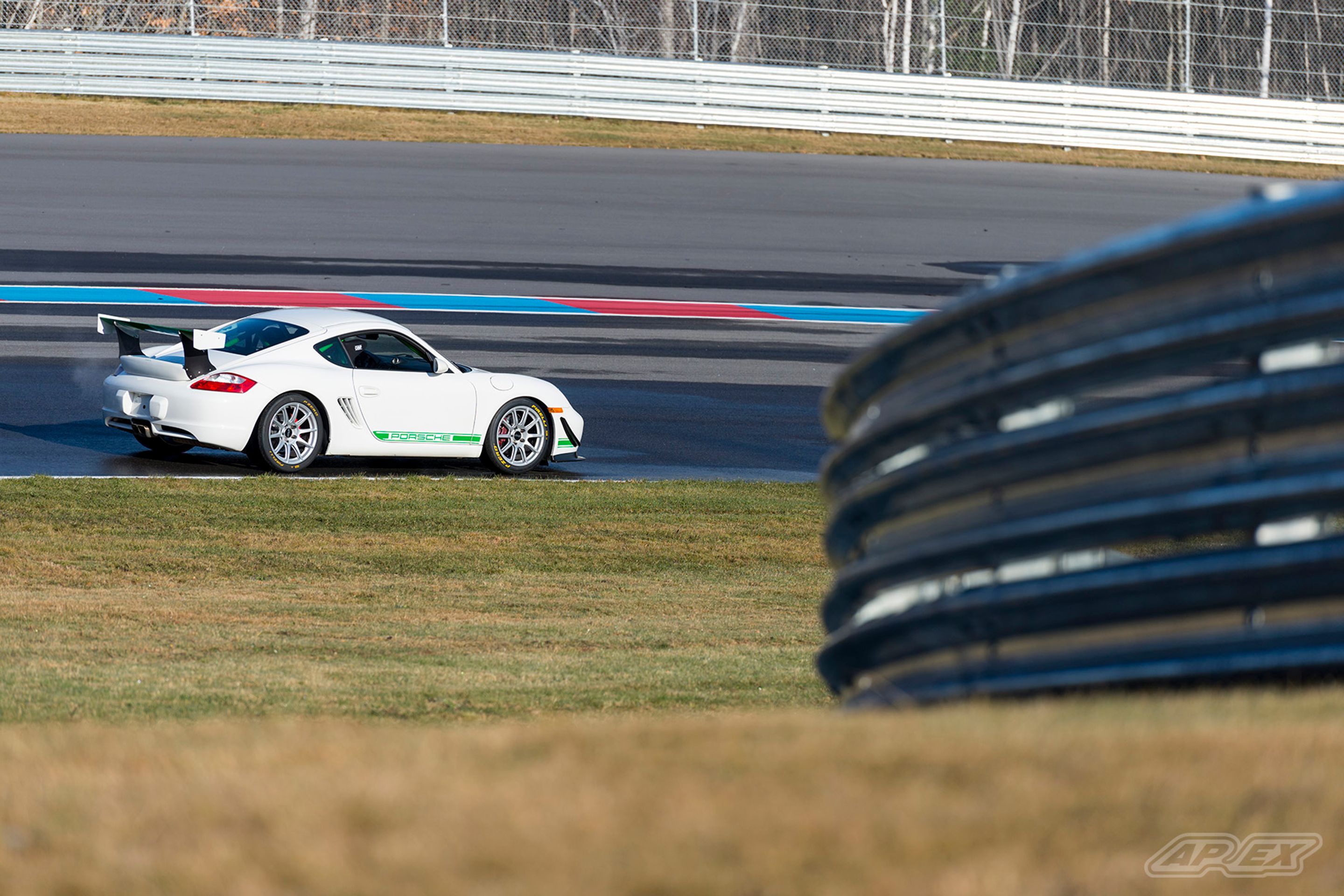 White Porsche 987 Cayman S with 18" SM-10 Apex wheels in Race Silver