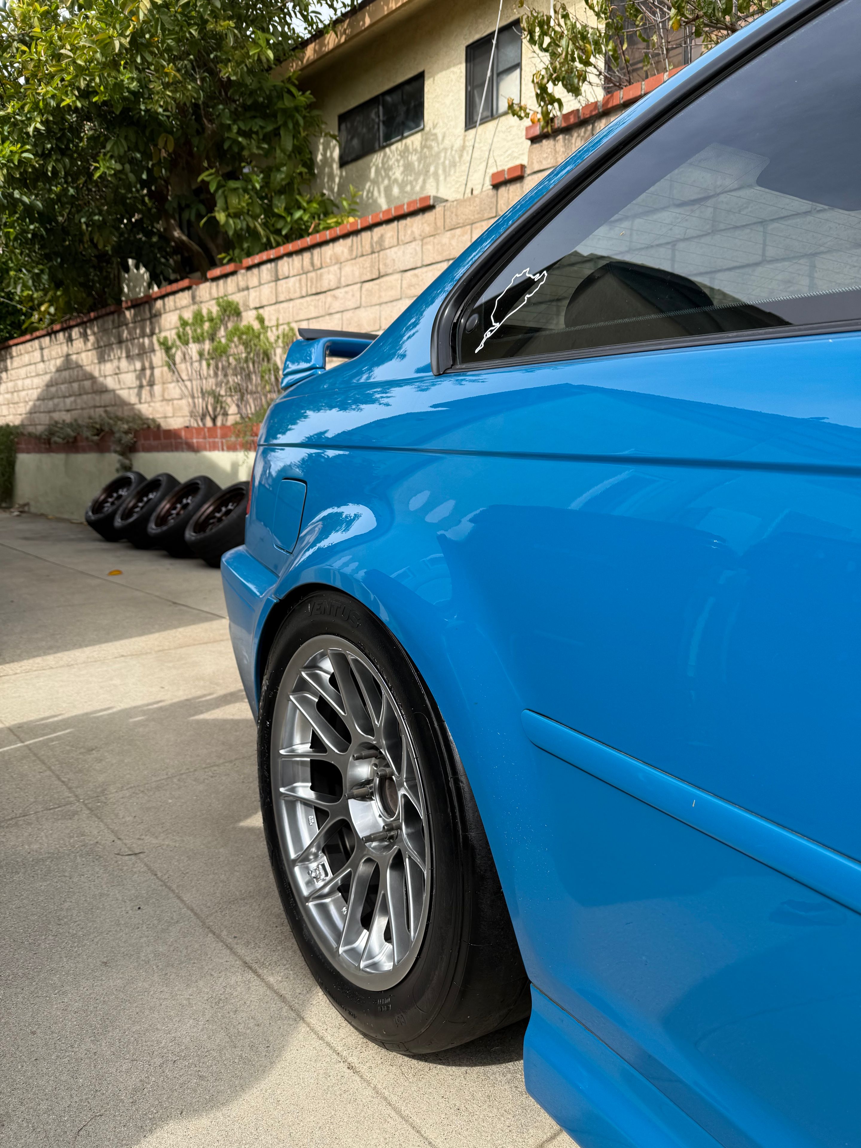 Blue BMW E46 M3 with 17" ARC-8 Apex wheels in Hyper Black