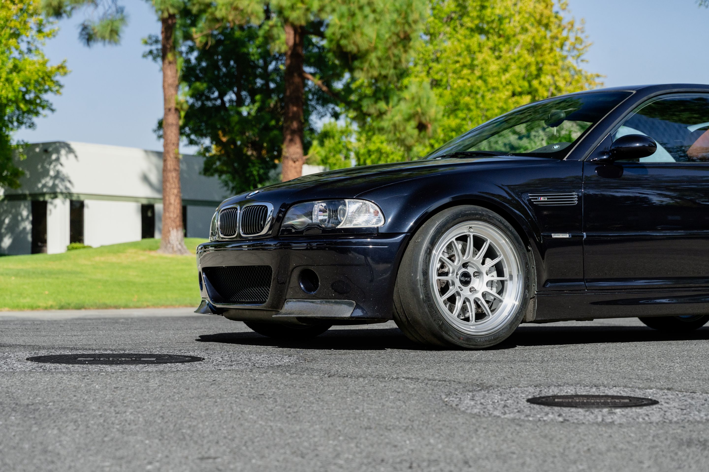 Black BMW E46 M3 with 18" SL-12 Apex wheels in Machined Lip Race Silver