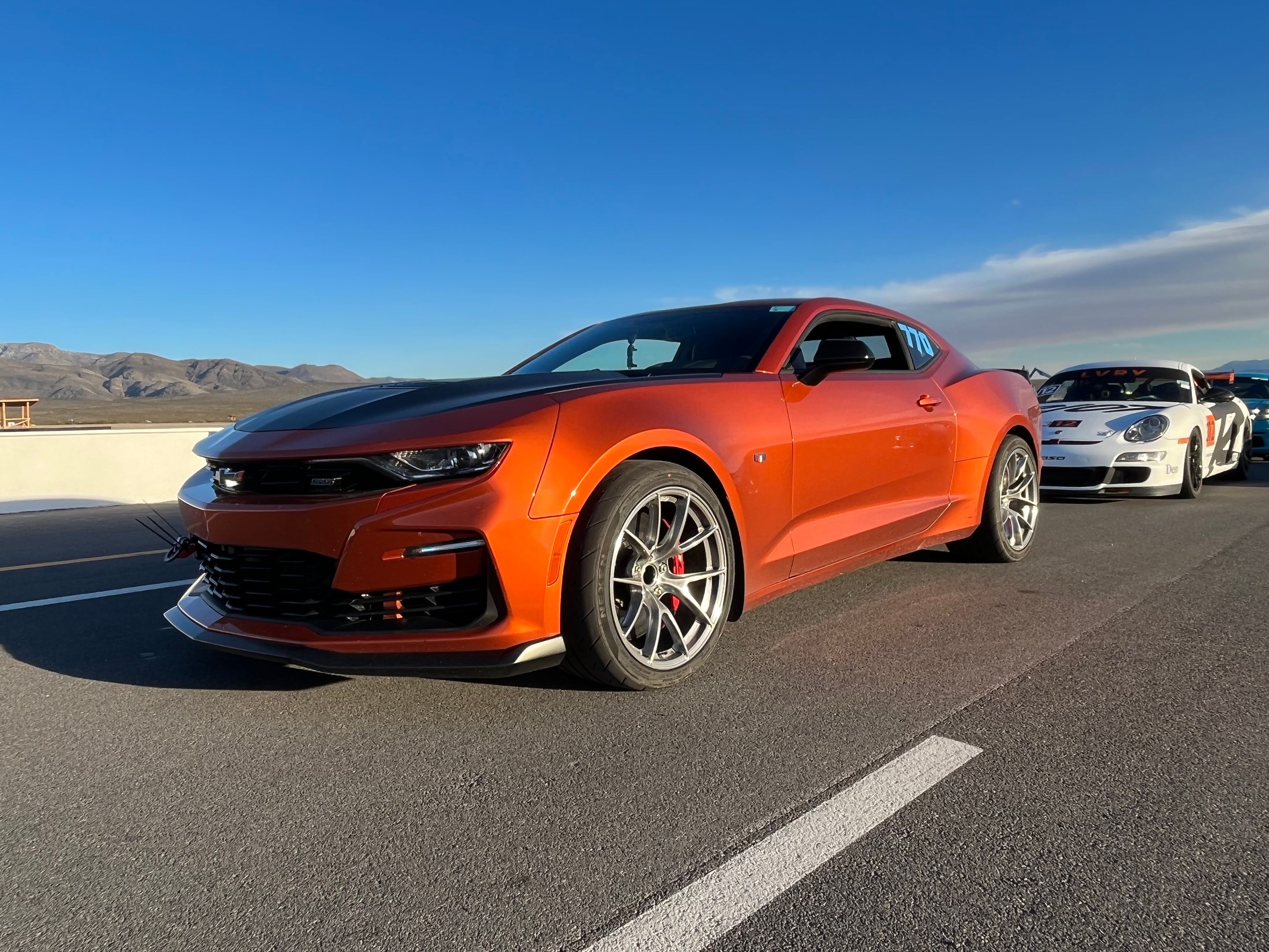 Orange Chevrolet 6th Gen Camaro SS 1LE with 19" VS-5RS Apex wheels in Brushed Clear
