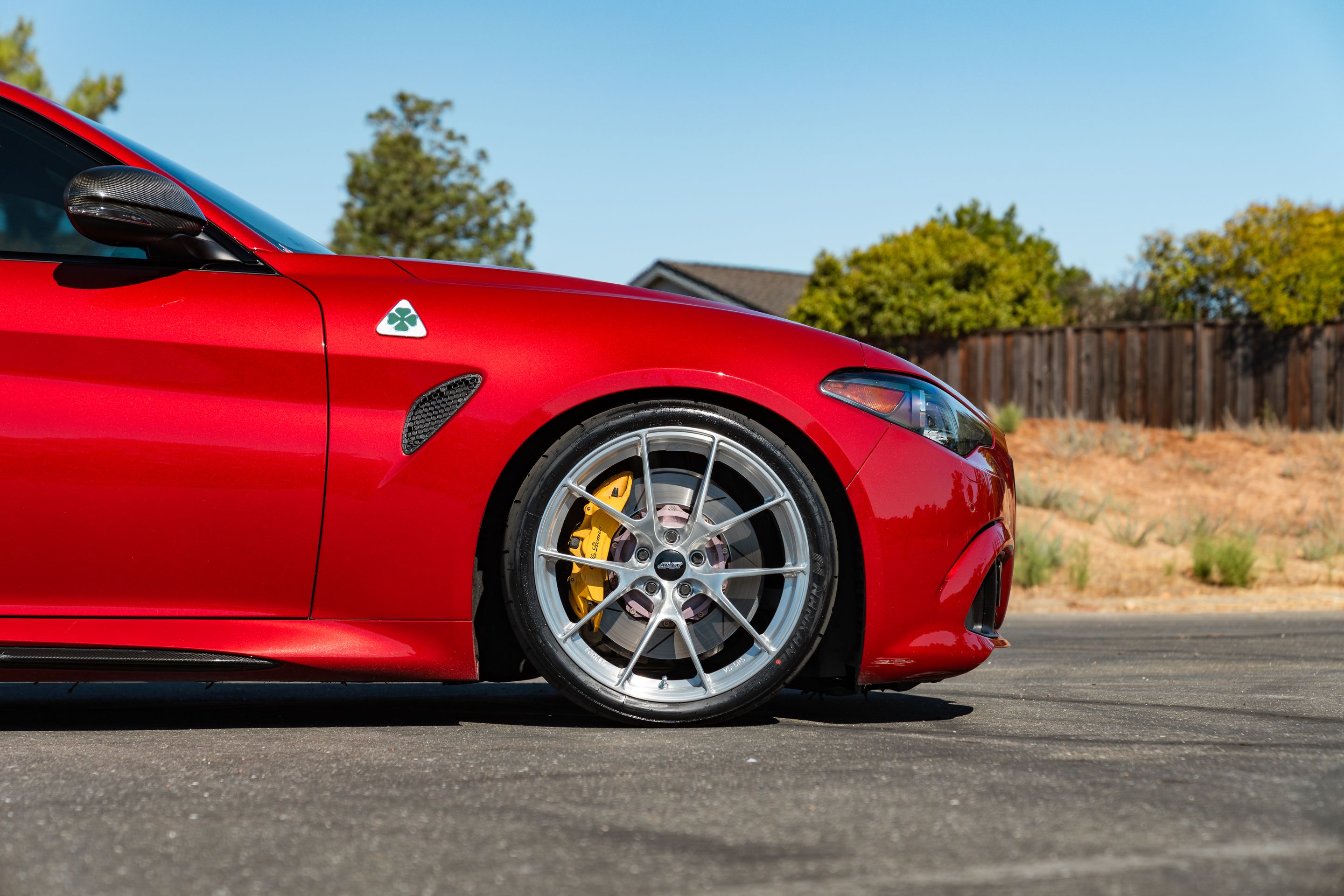 Red Alfa Romeo Giulia Quadrifoglio with 19" VS-5RS Apex wheels in Brushed Clear