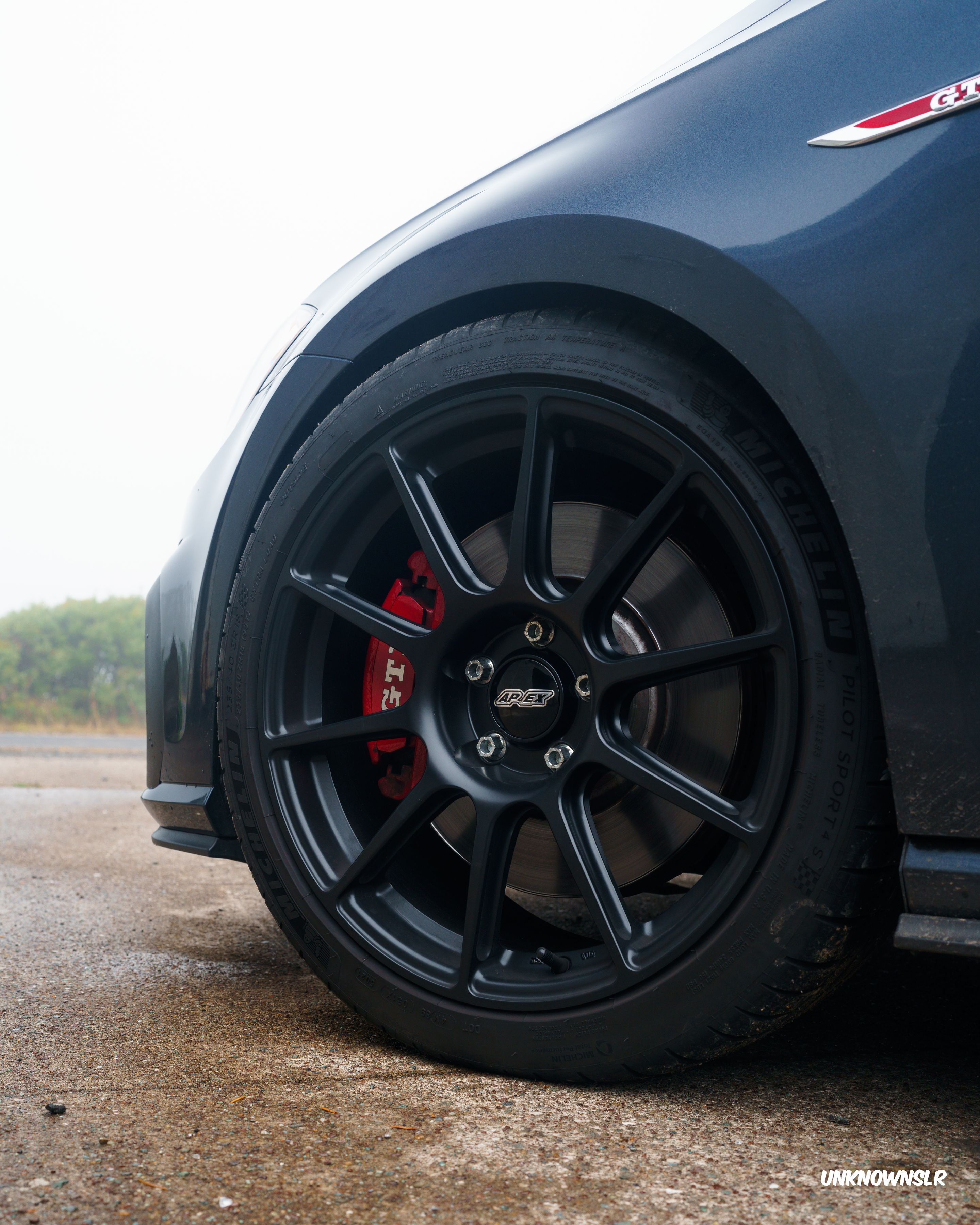 Blue VW MK7 GTI with 18" SM-10 Apex wheels in Satin Black