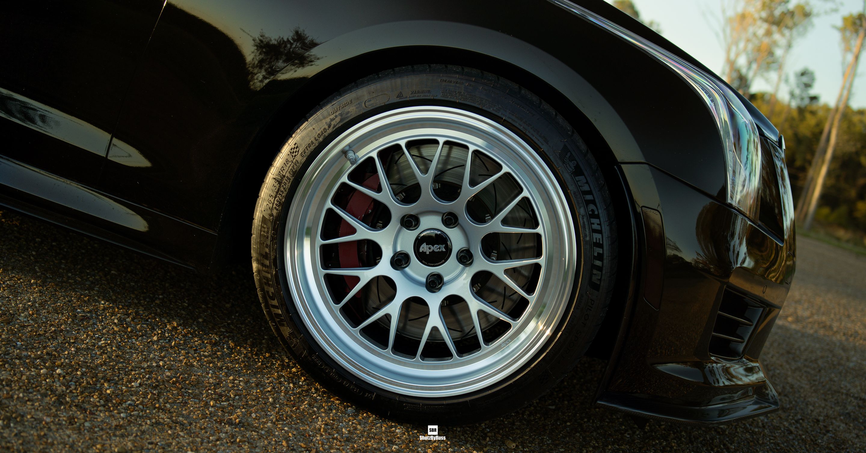 Black Cadillac ATS-V with 18" ML-10RT Apex wheels in Machined Lip Race Silver