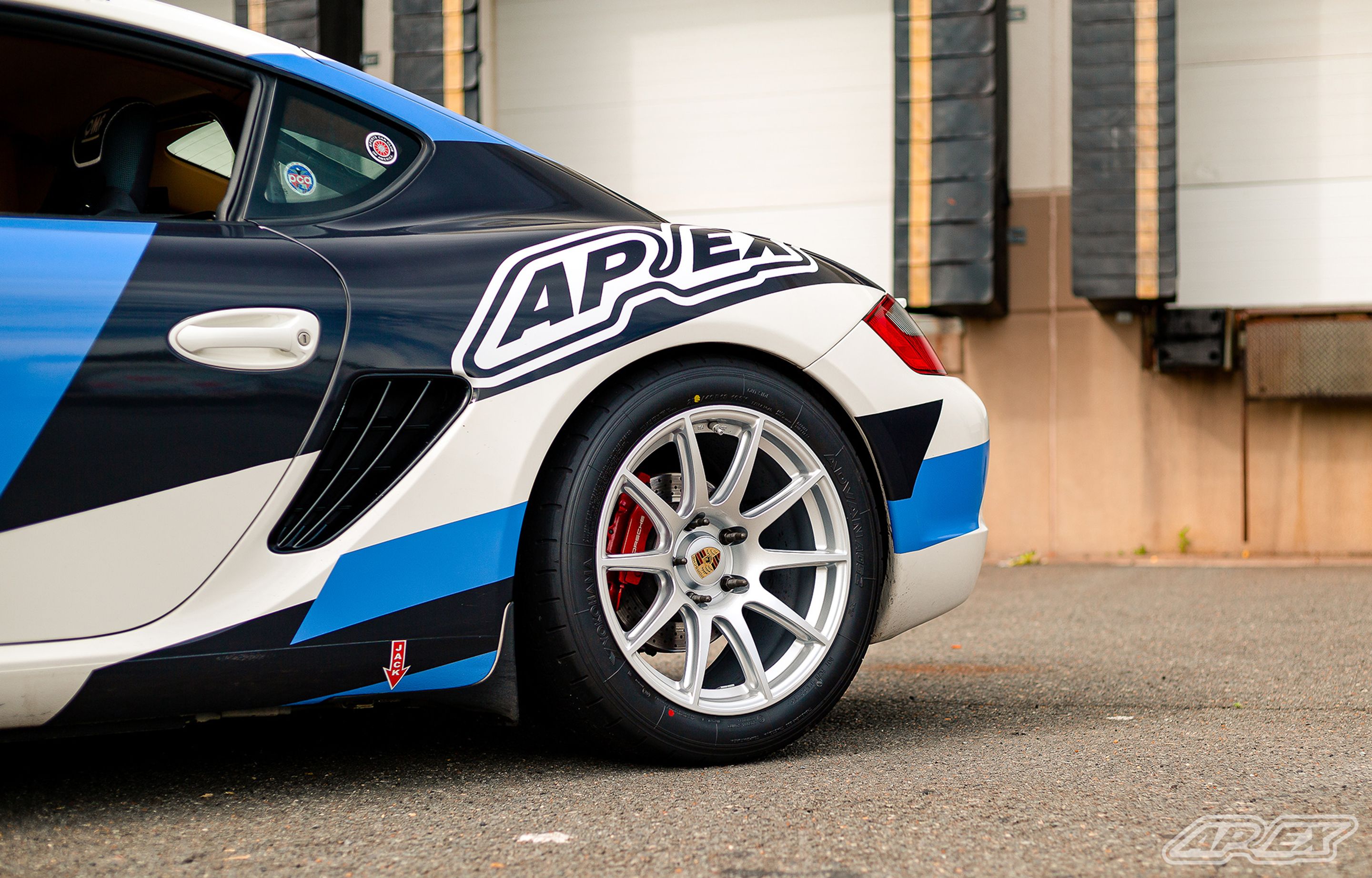 White Porsche 987 Cayman S with 18" SM-10 Apex wheels in Race Silver