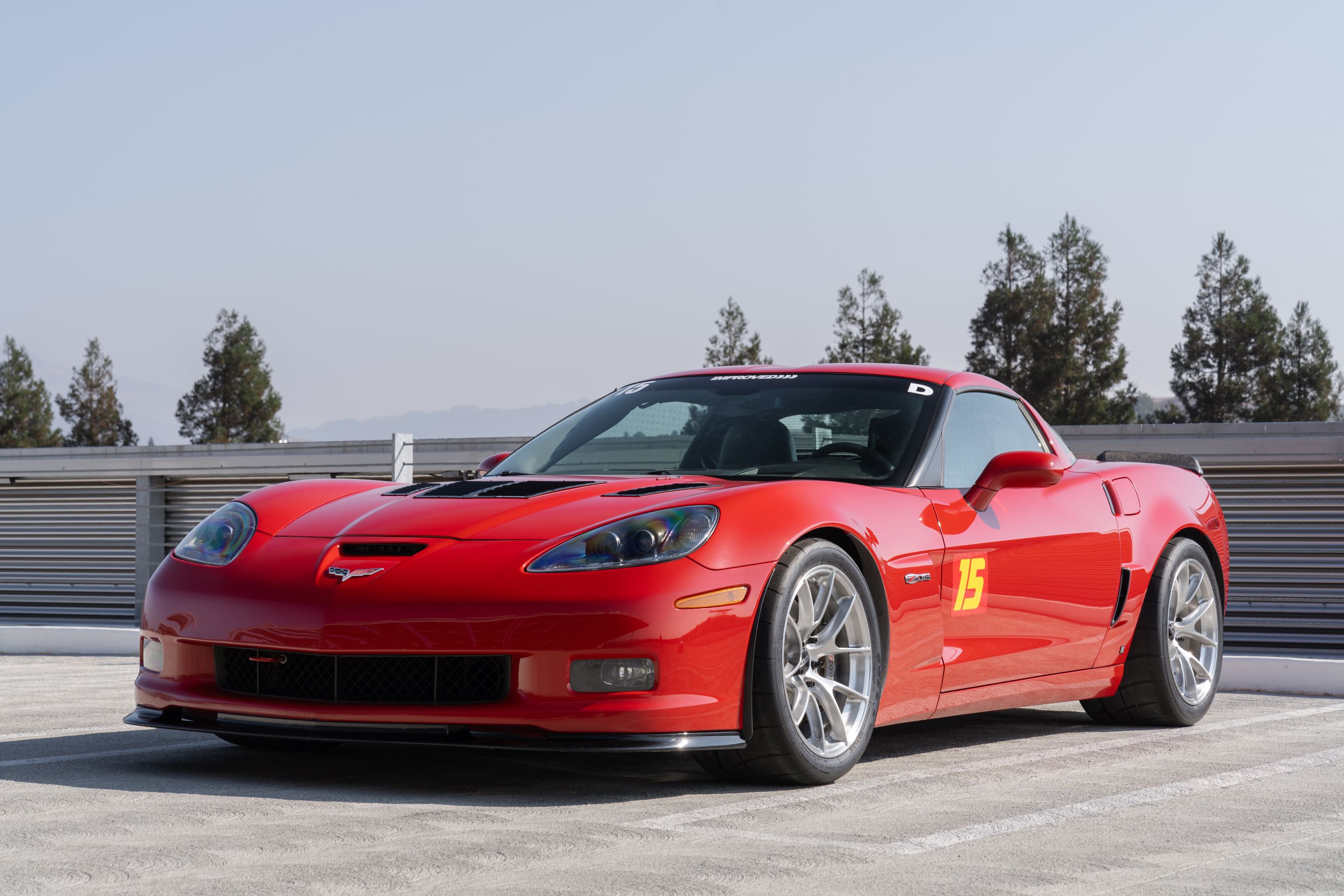 Red Chevrolet C6 Corvette Z06 with 18" VS-5RS Apex wheels in Brushed Clear
