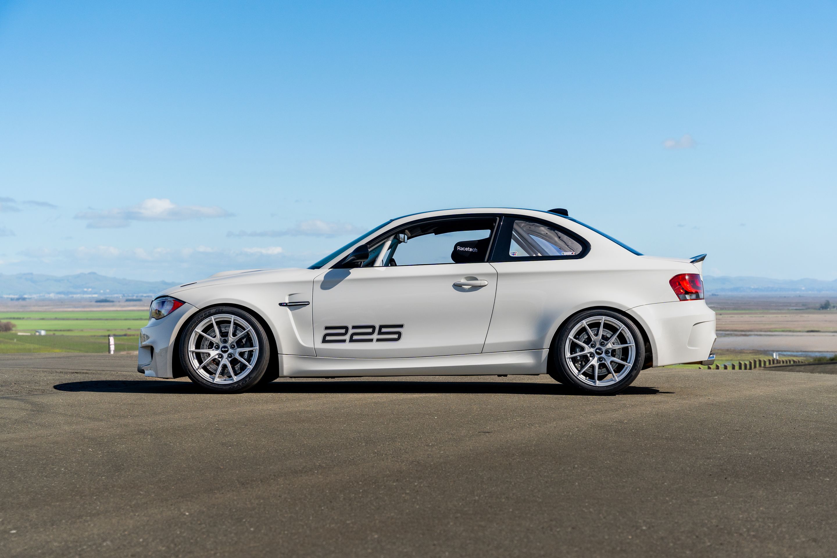 White BMW E82 1M with 18" VS-5 Apex wheels in Race Silver