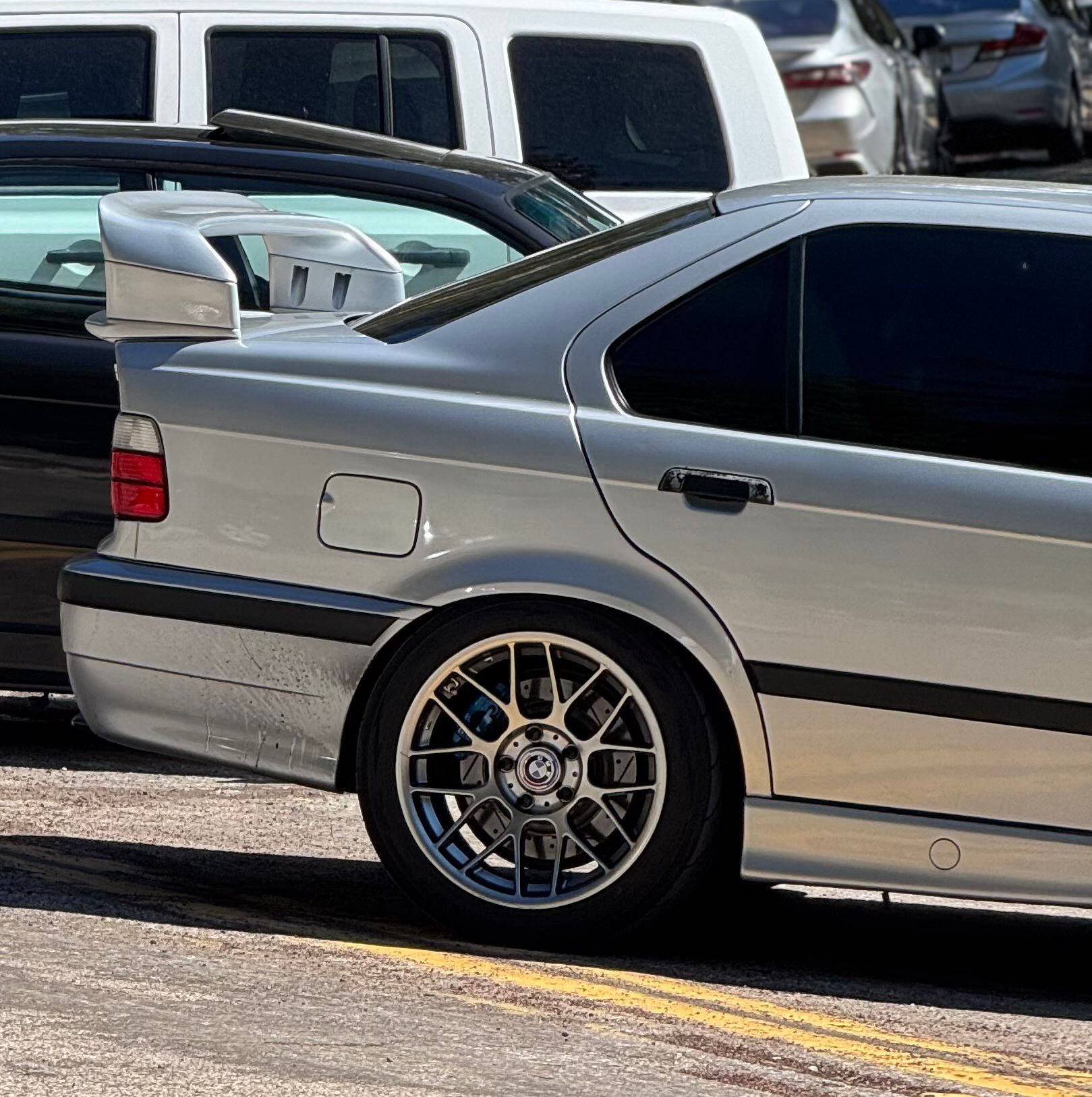 Silver BMW E36 M3 with 17" ARC-8 Apex wheels in Hyper Black