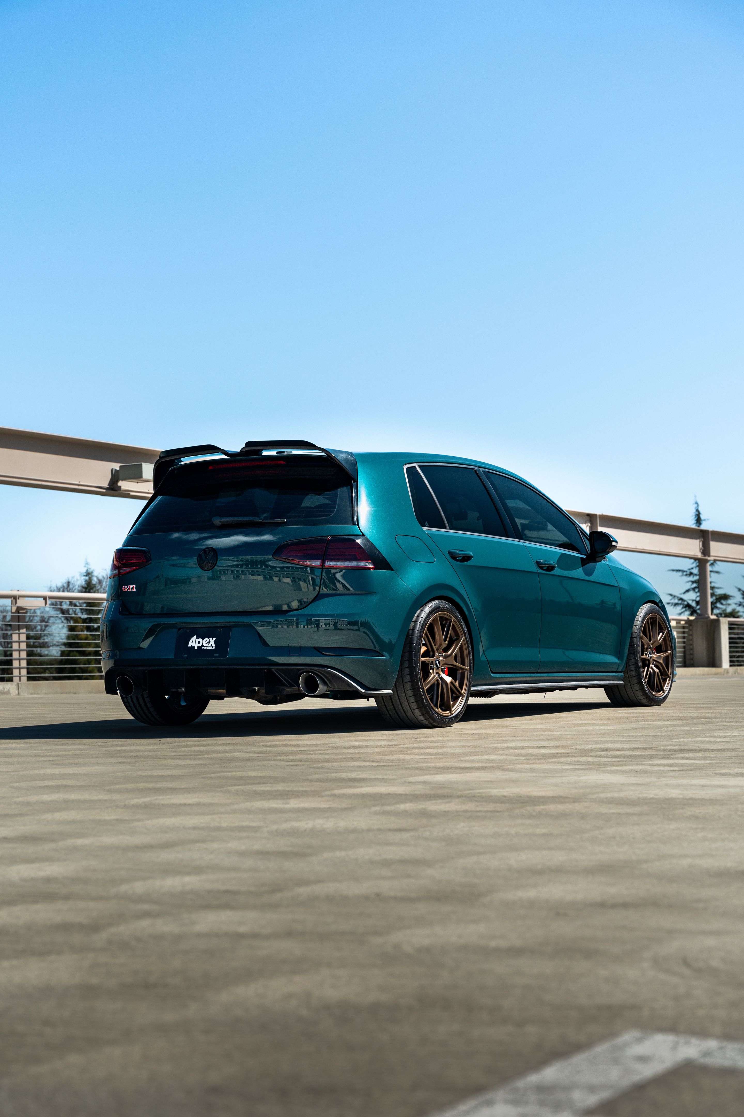Green VW MK7 GTI with 18" VS-5 Apex wheels in Satin Bronze