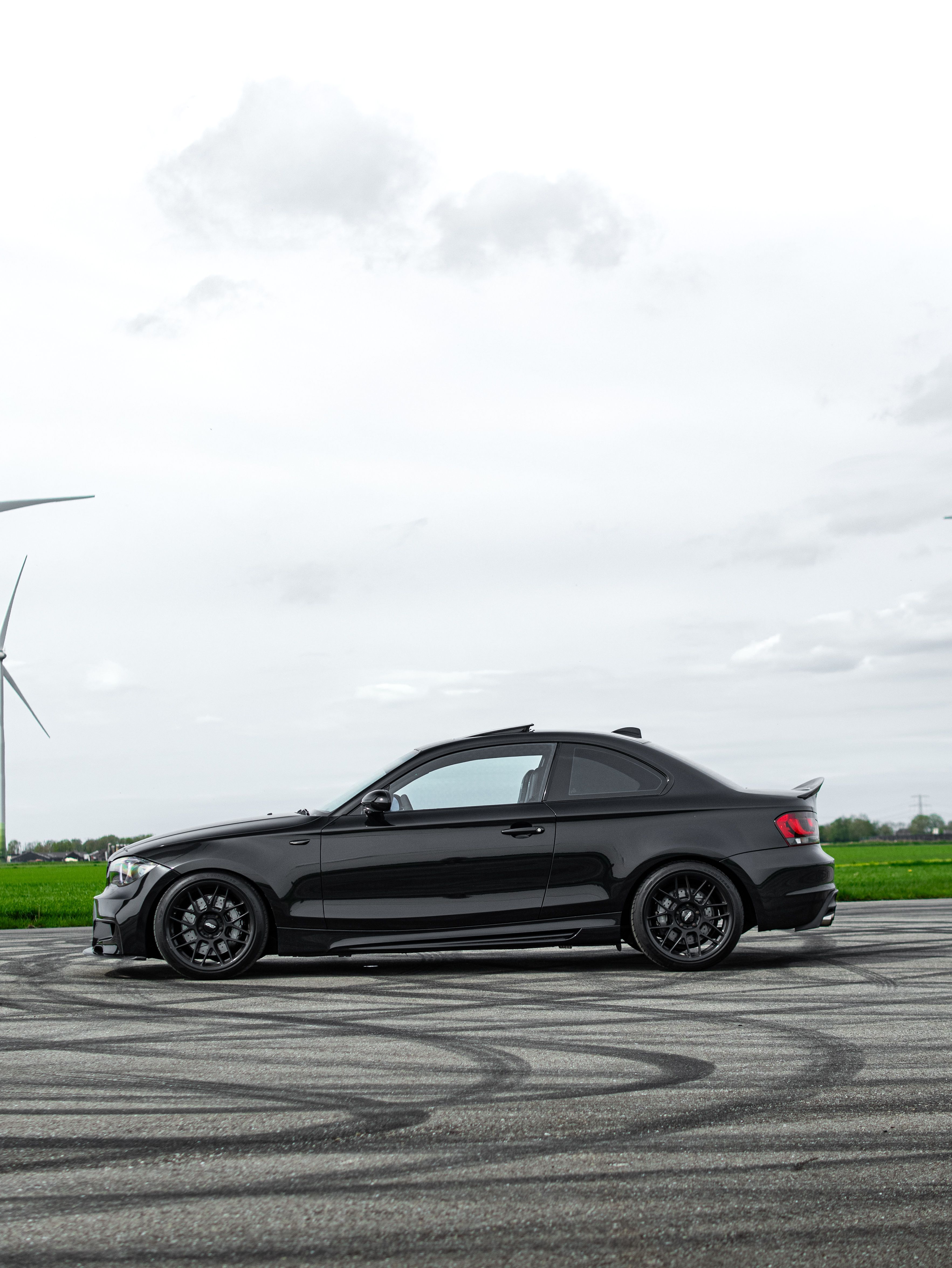 Black BMW E82 Coupe 1 Series with 18" ARC-8 Apex wheels in Satin Black