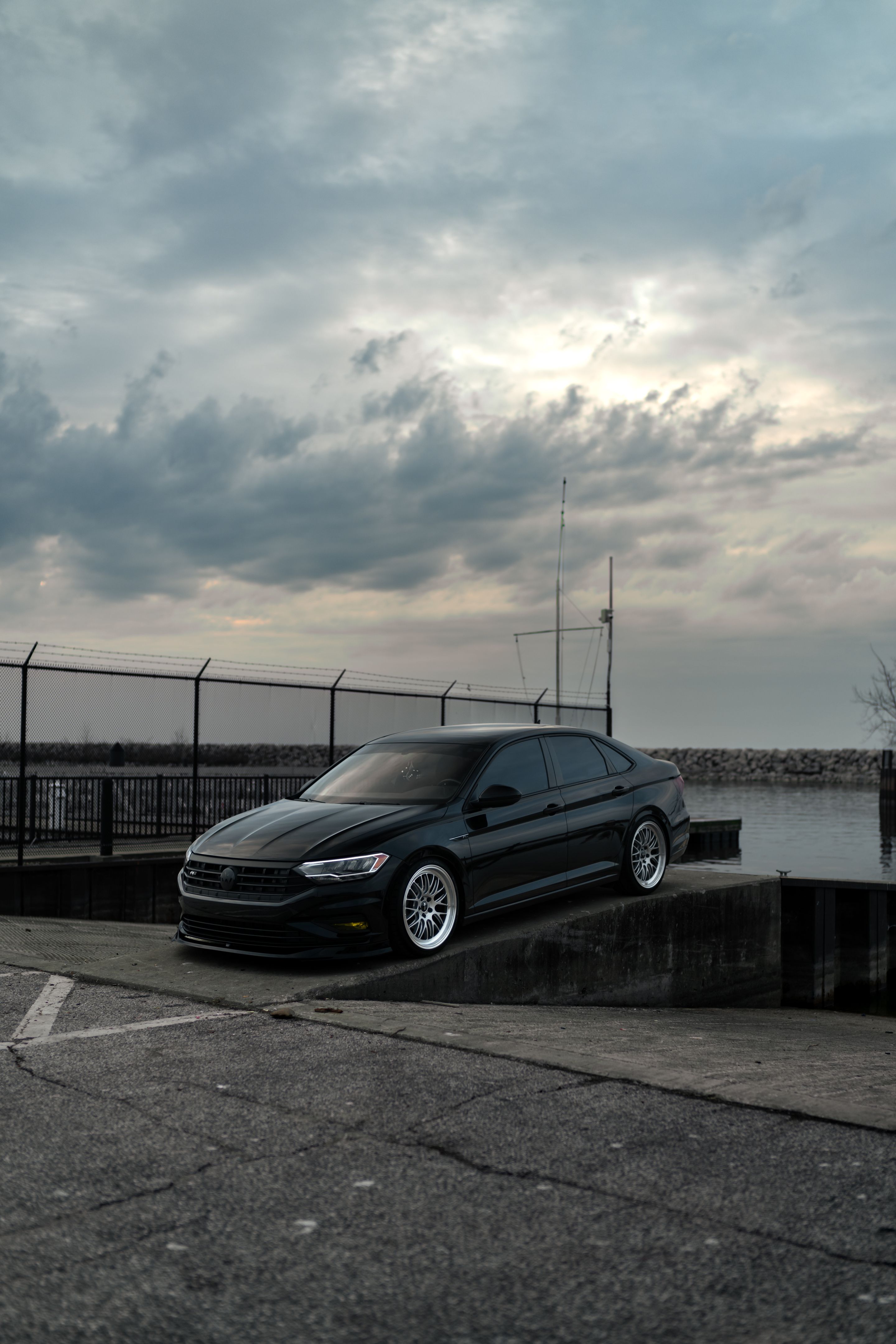 Black VW MK7 Jetta with 19" ML-10RT Apex wheels in Machined Lip Race Silver