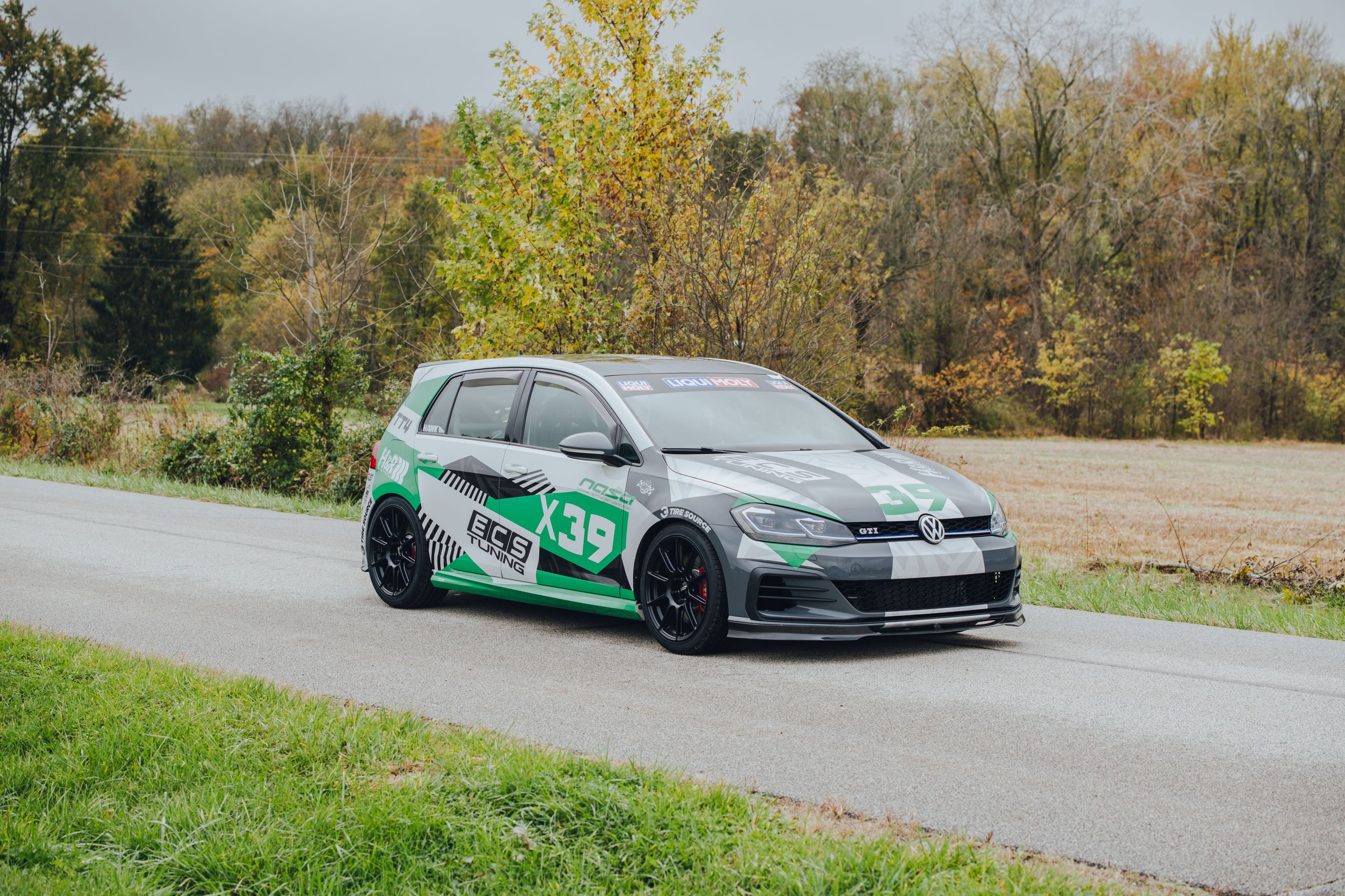 Race Livery VW MK7 GTI with 18" SM-10 Apex wheels in Satin Black