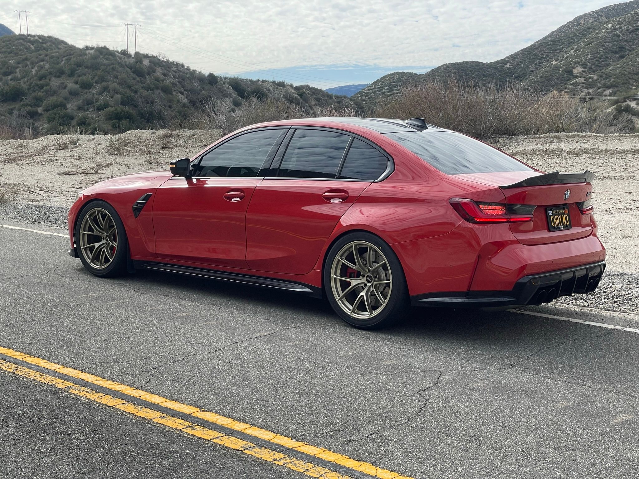 Red BMW G80 M3 with 19" VS-5RS Apex wheels in Motorsport Gold
