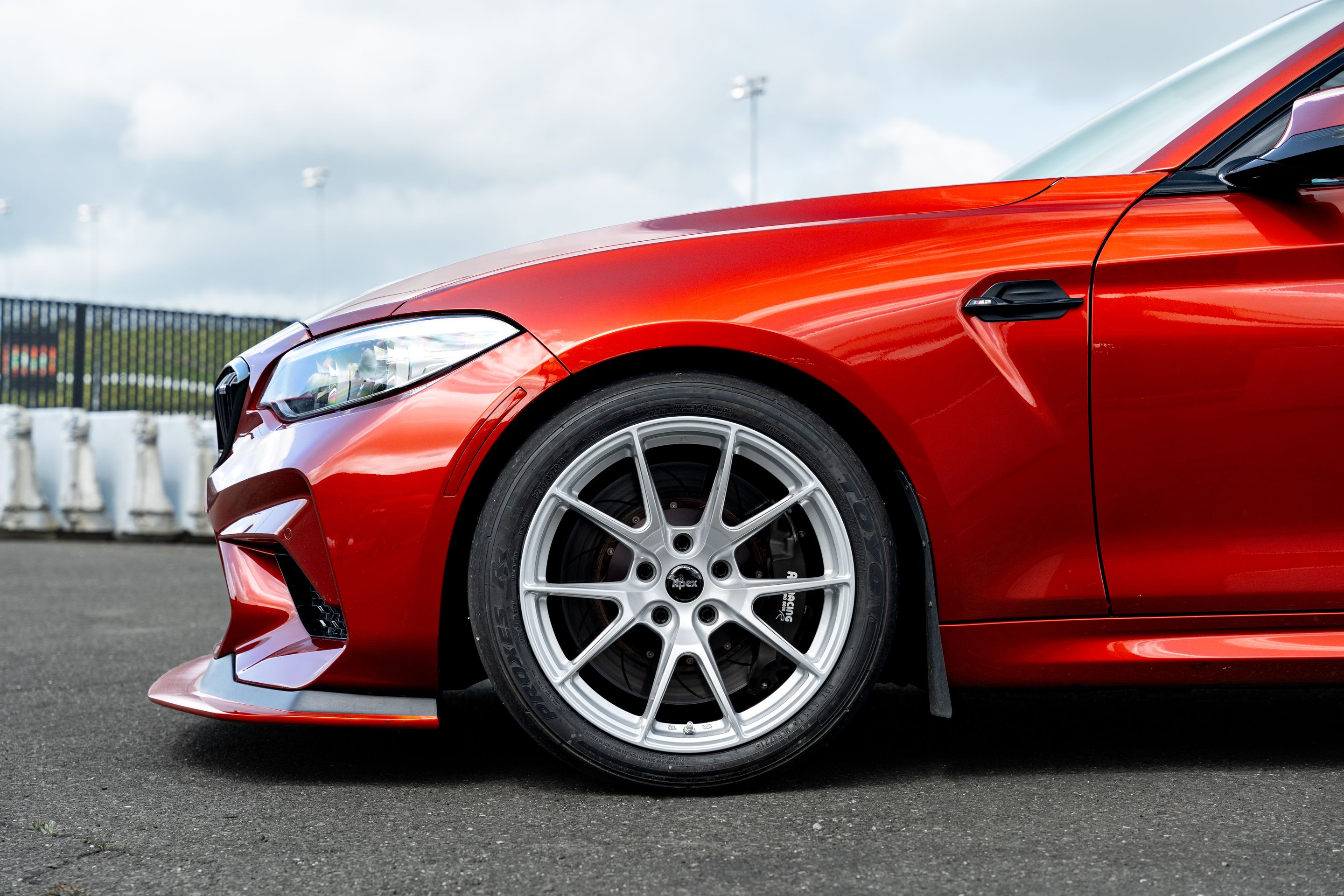Orange BMW F87 M2 with 18" VS-5 Apex wheels in Race Silver