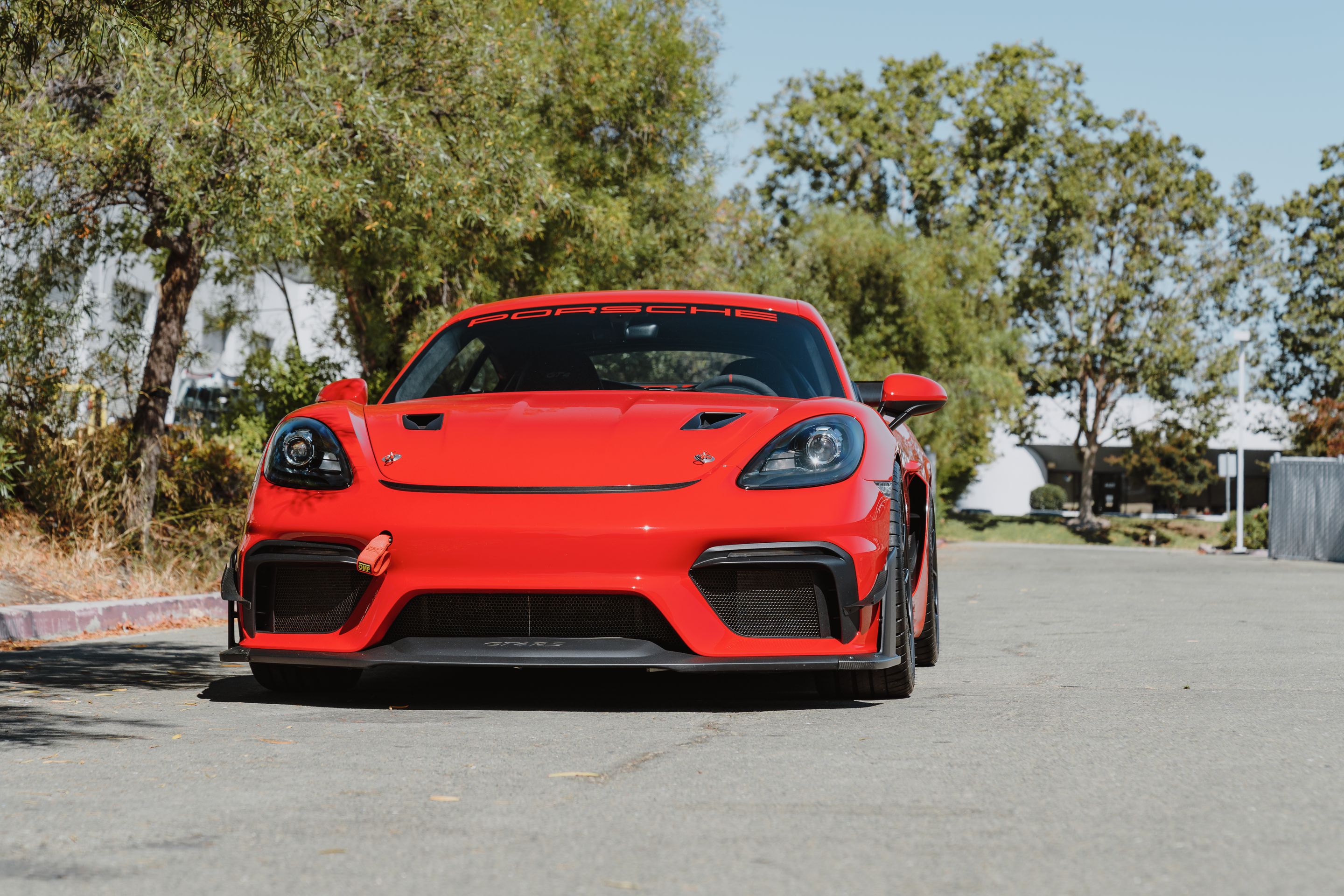 Red Porsche 718 Cayman GT4 with 19" VS-5RS Apex wheels in Satin Black