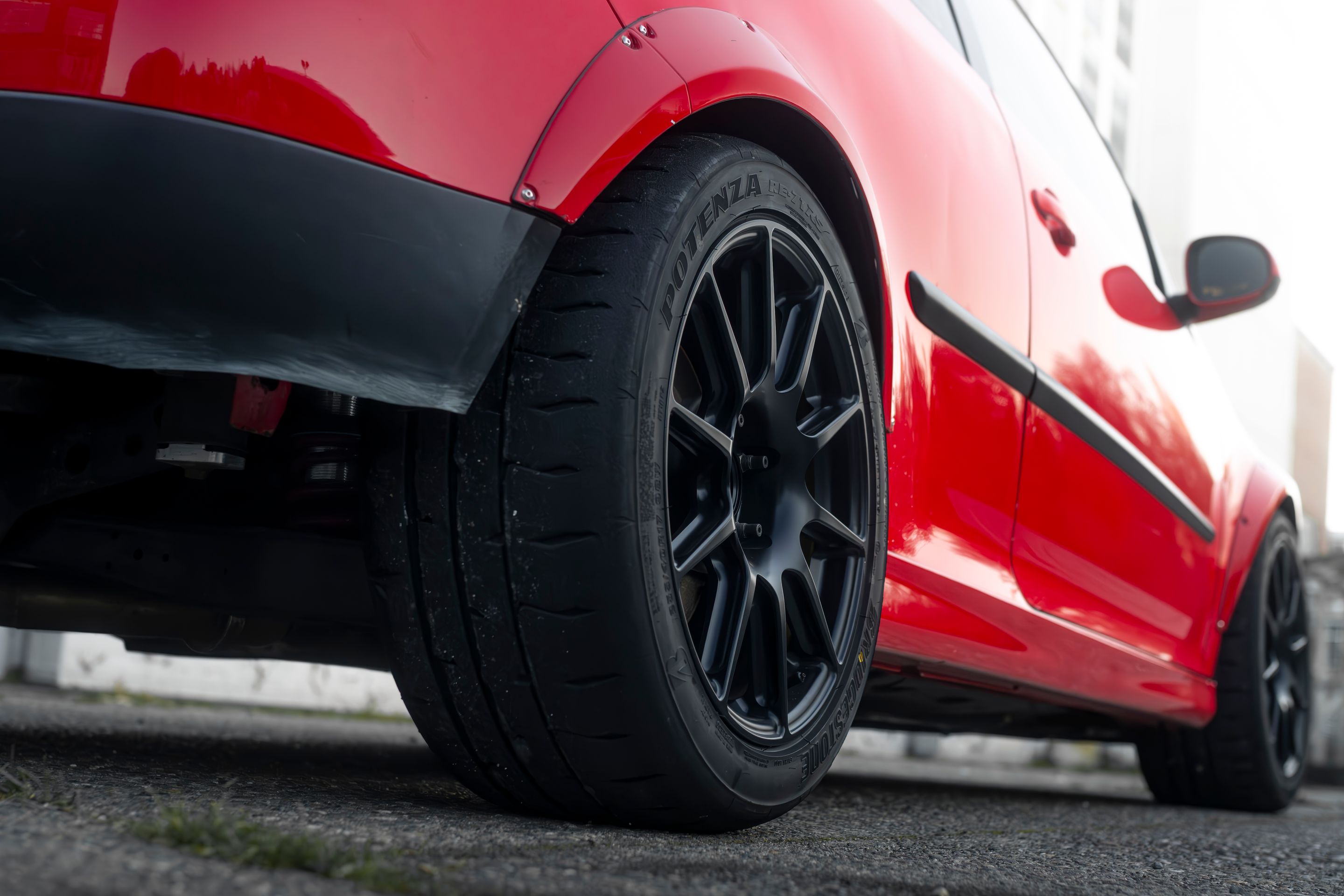 Red VW MK5 Golf with 17" SM-10 Apex wheels in Satin Black