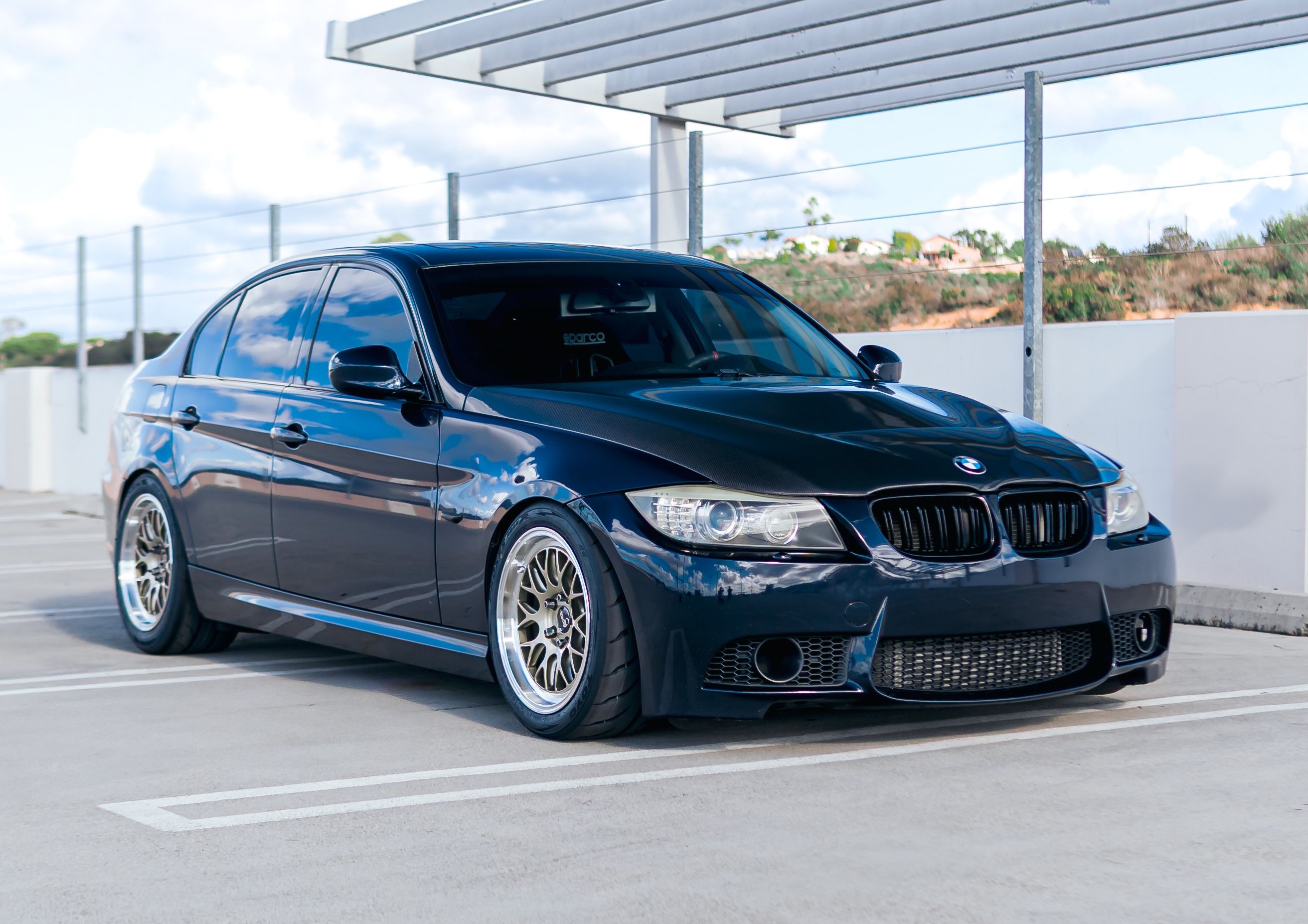 Black BMW E90 Sedan 3 Series with 17" ML-10RT Apex wheels in Machined Lip Gloss Motorsport Gold