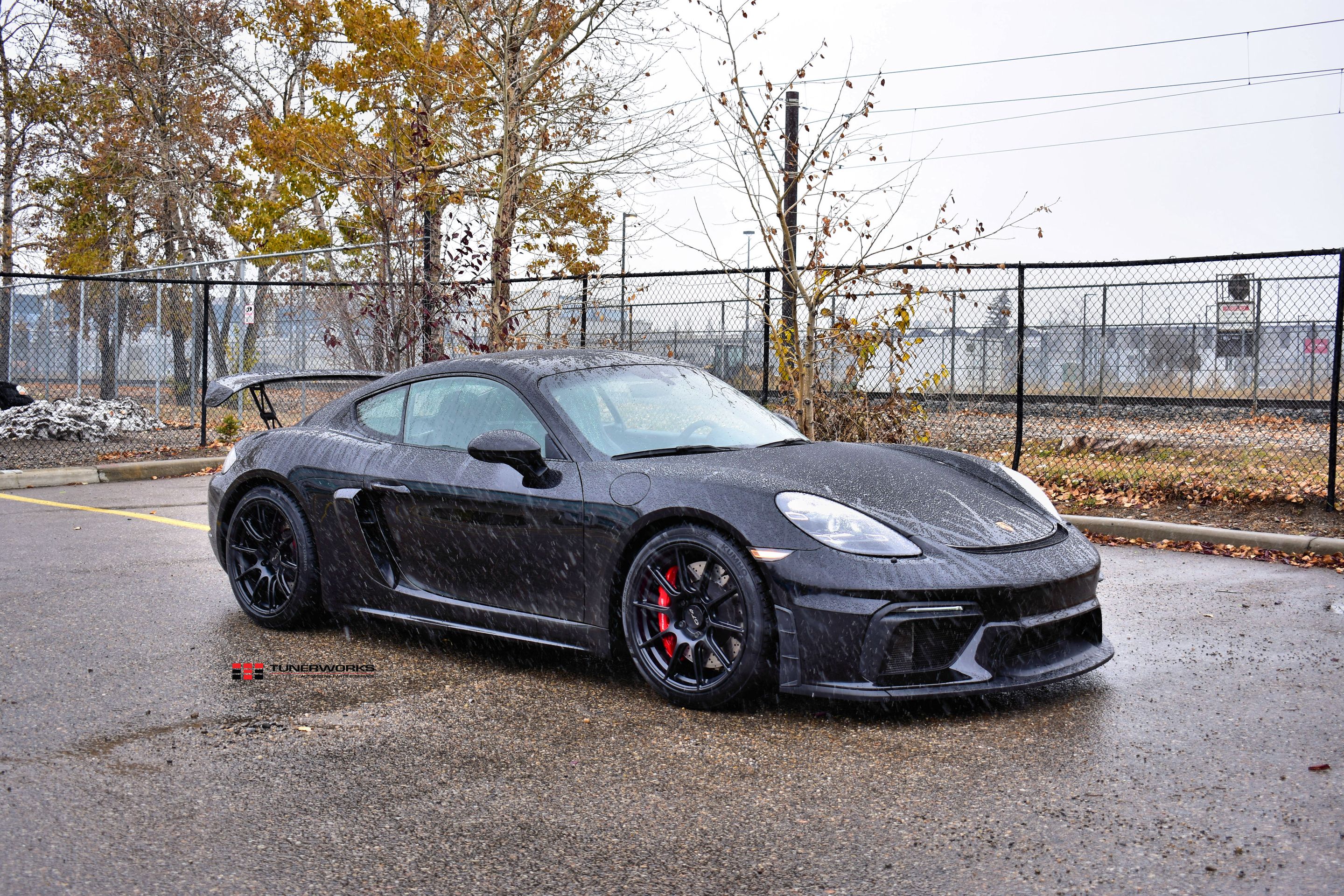 Black Porsche 718 Cayman GT4 with 19" SM-10 Apex wheels in Satin Black