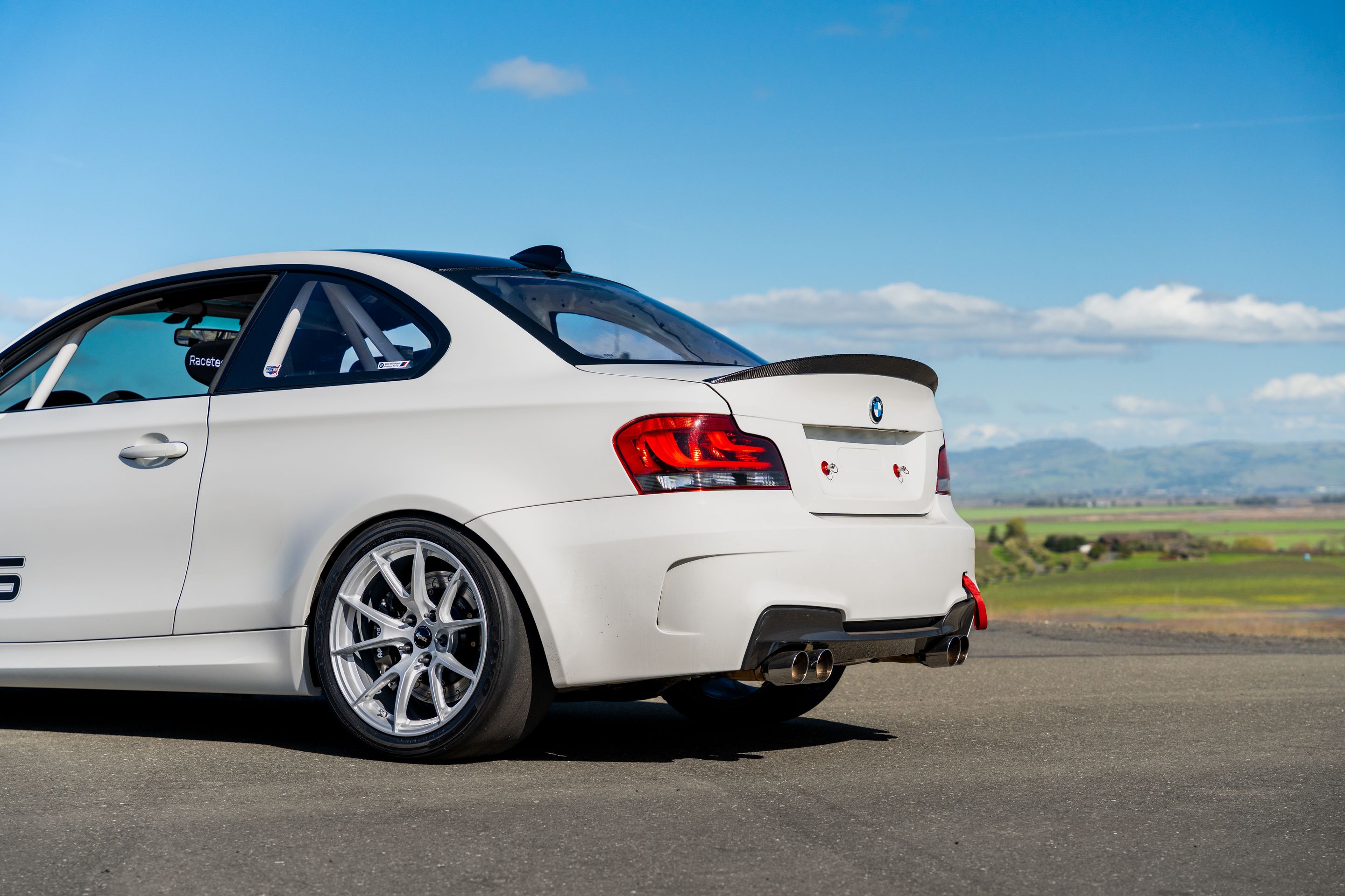 White BMW E82 1M with 18" VS-5 Apex wheels in Race Silver