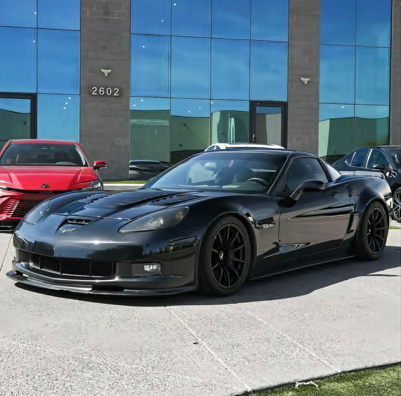 Black Chevrolet C6 Corvette Z06 with 18" SM-10 Apex wheels in Satin Black