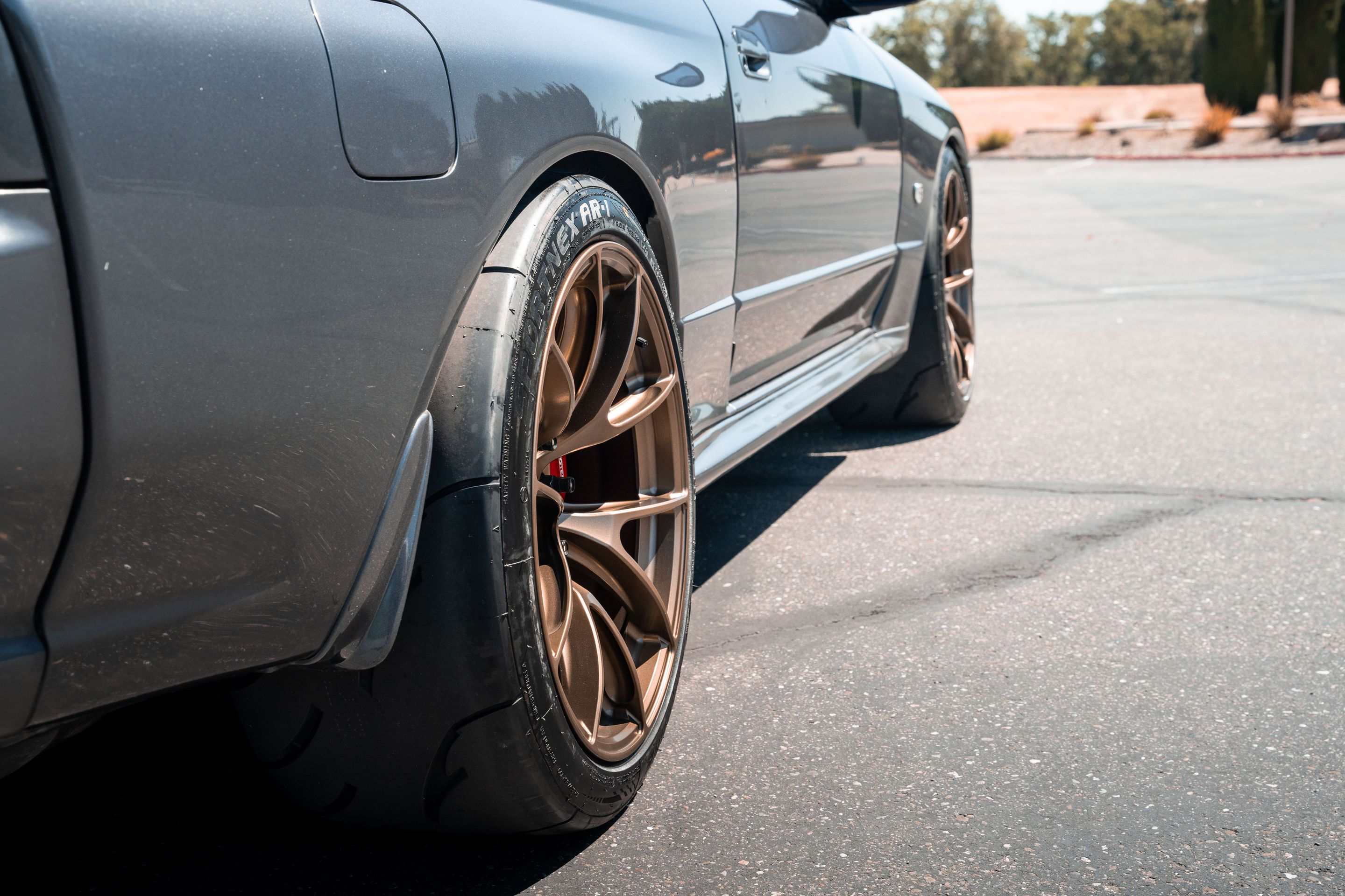 Grey Nissan R32 GT-R with 18" VS-5RS Apex wheels in Satin Bronze