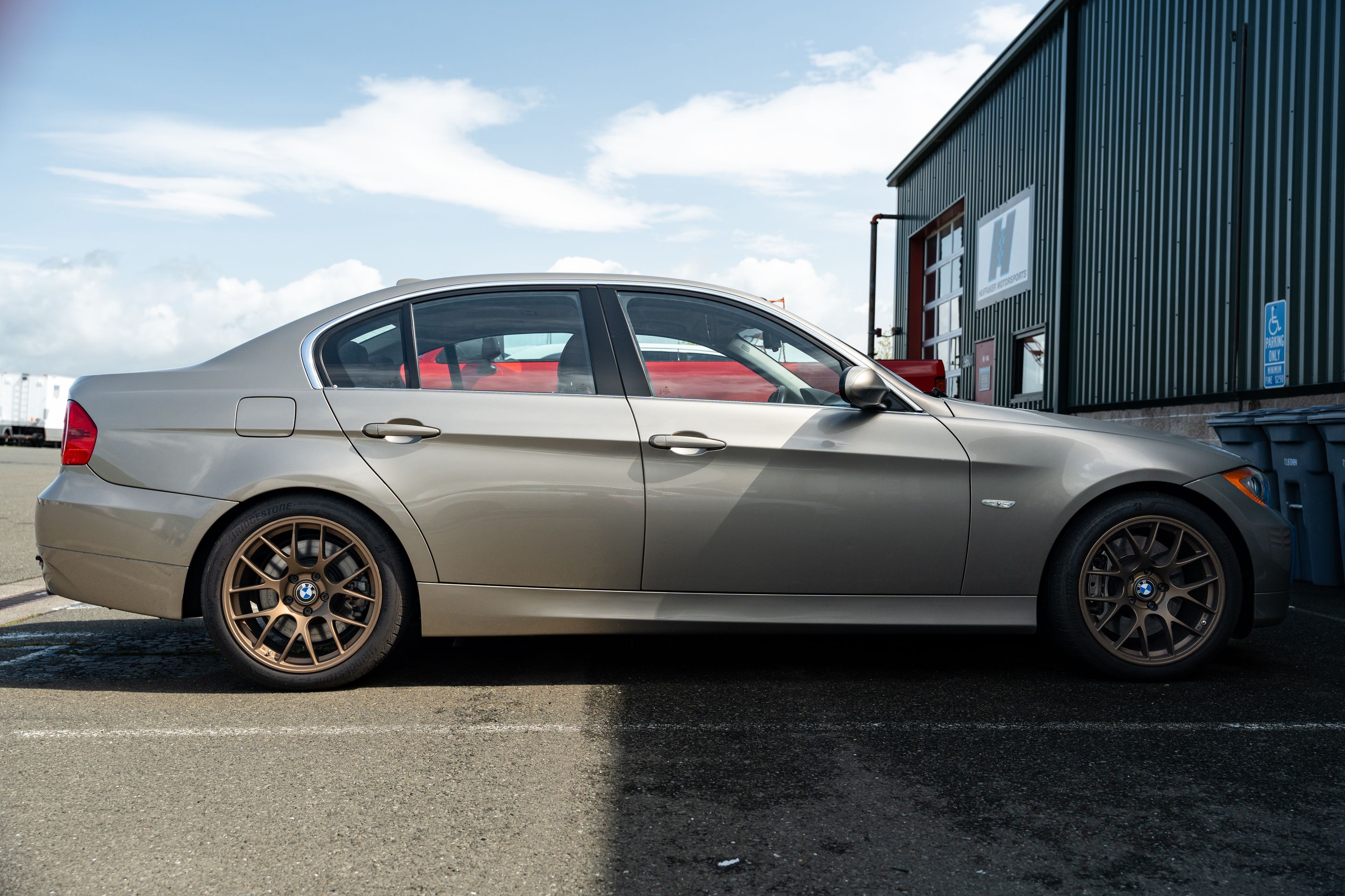 Silver BMW E90 Sedan 3 Series with 18" EC-7 Apex wheels in Satin Bronze