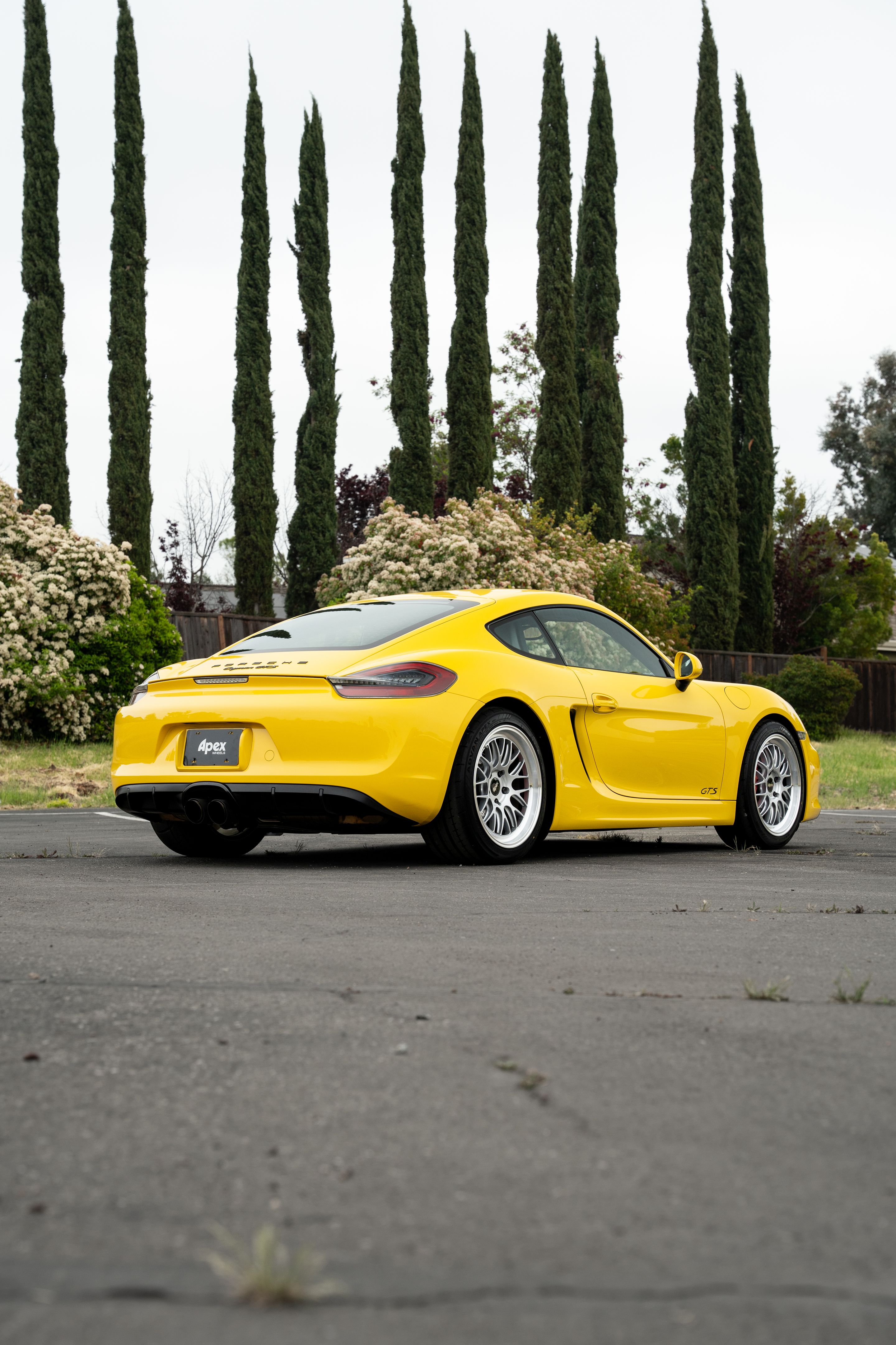 Yellow Porsche 981 Cayman GTS with 19" ML-10RT Apex wheels in Machined Lip Race Silver