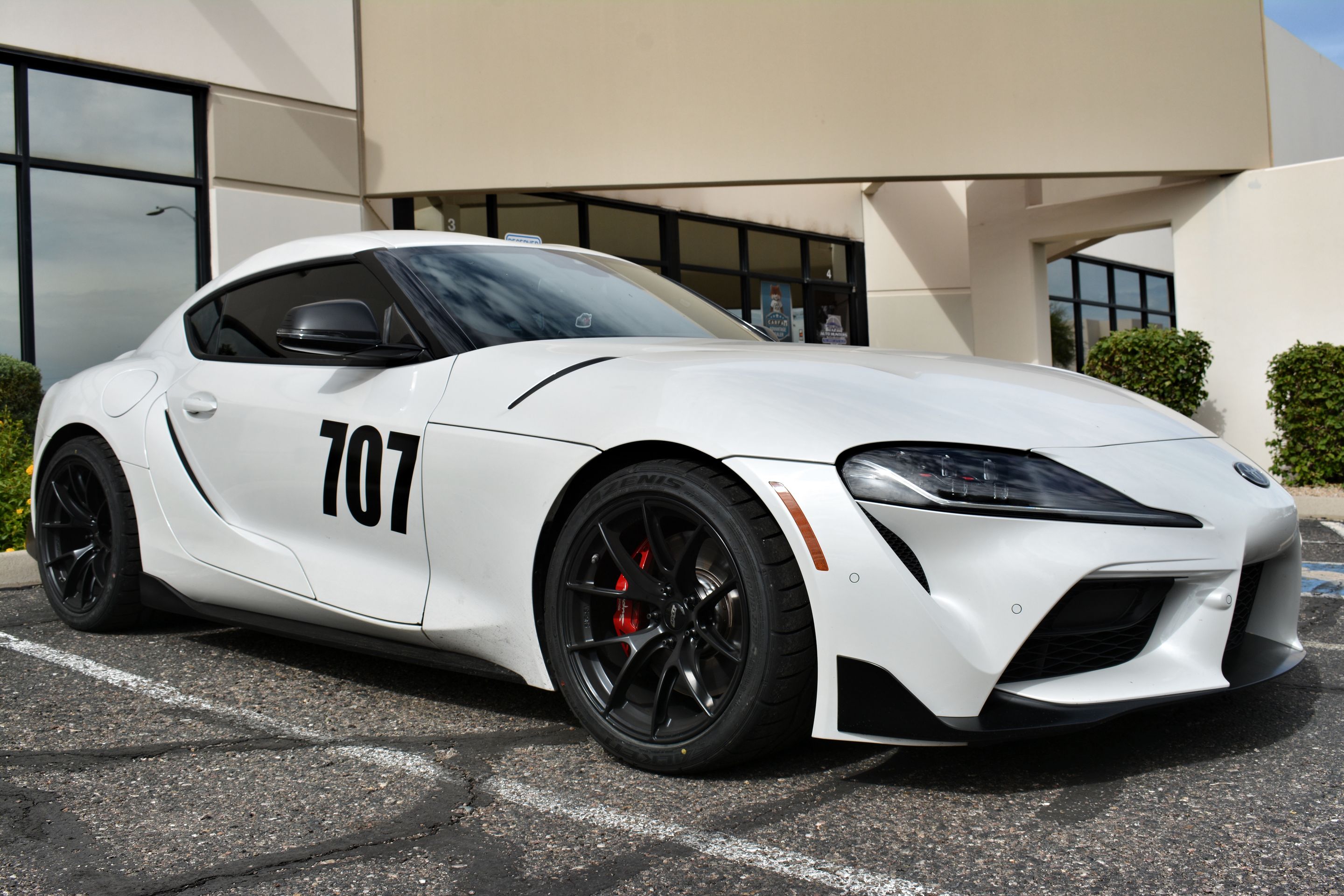 White Toyota GR Supra with 18" VS-5RS Apex wheels in Satin Black