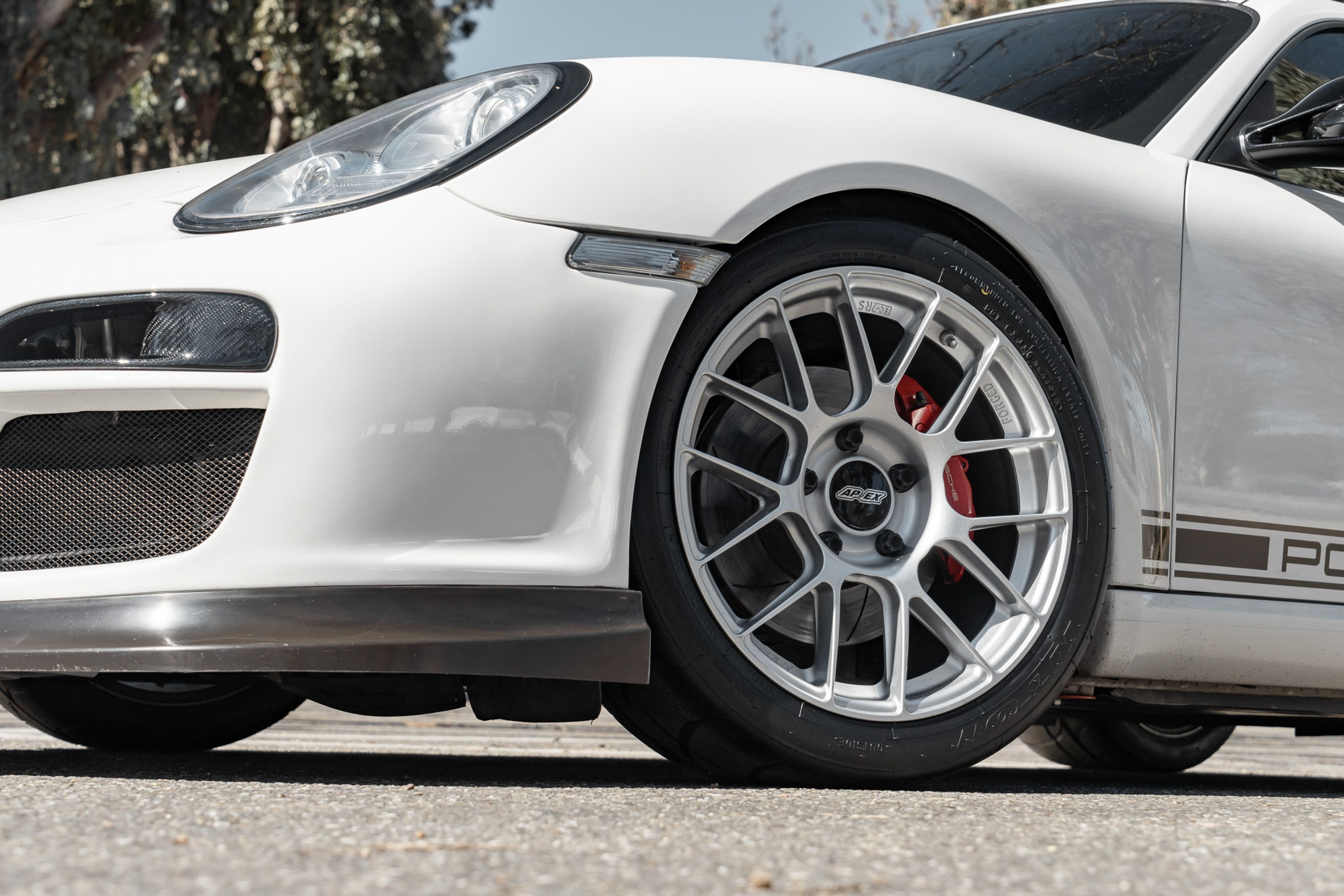 White Porsche 987 Cayman R with 18" EC-7RS Apex wheels in Race Silver