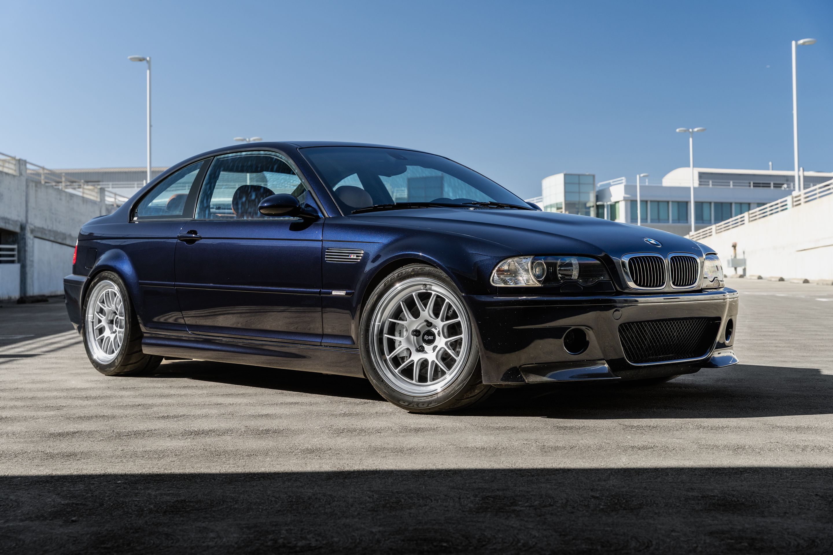 Black BMW E46 M3 with 18" ML-7RT Apex wheels in Machined Lip Race Silver