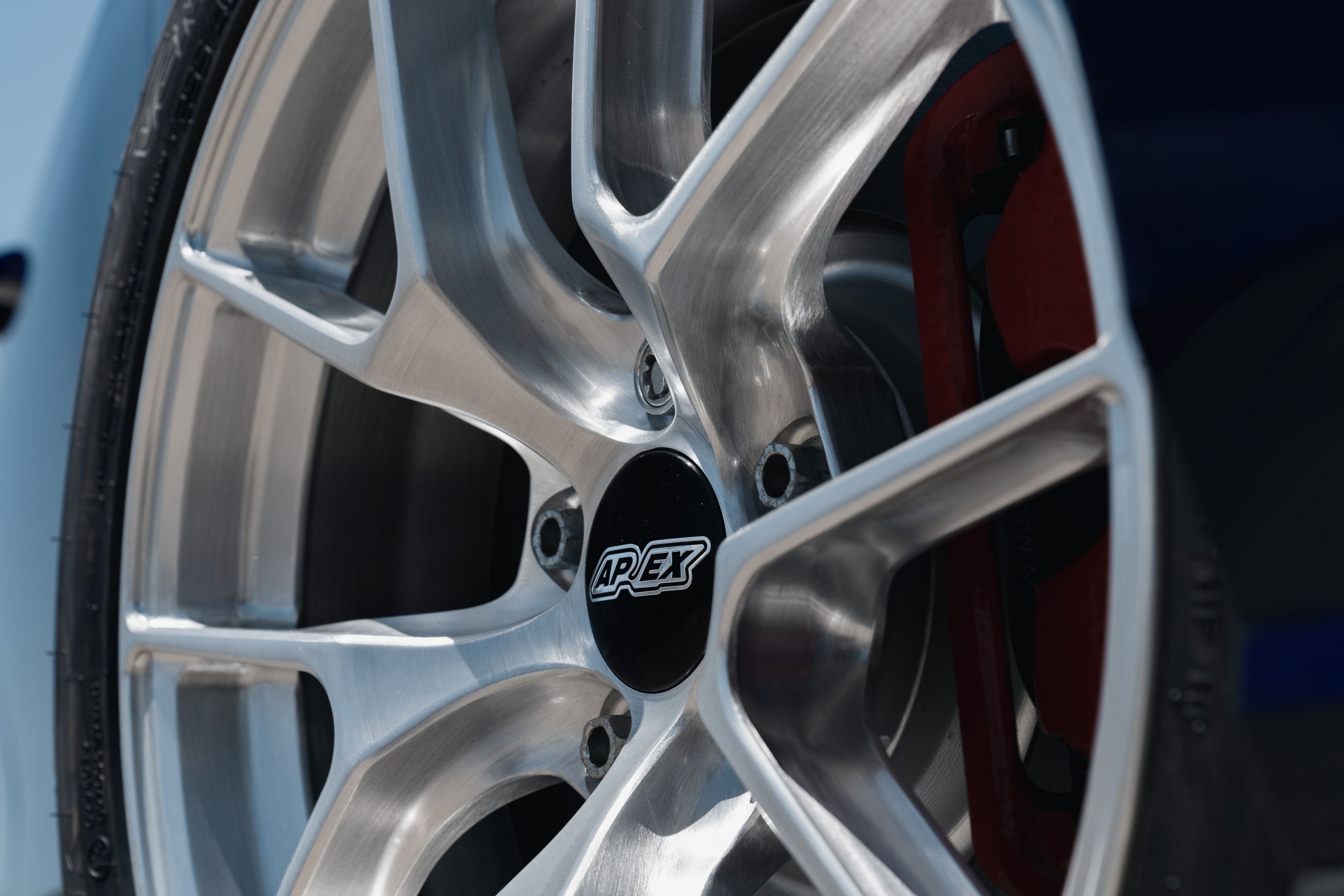 Blue VW MK8 GTI with 17" VS-5RS Apex wheels in Brushed Clear