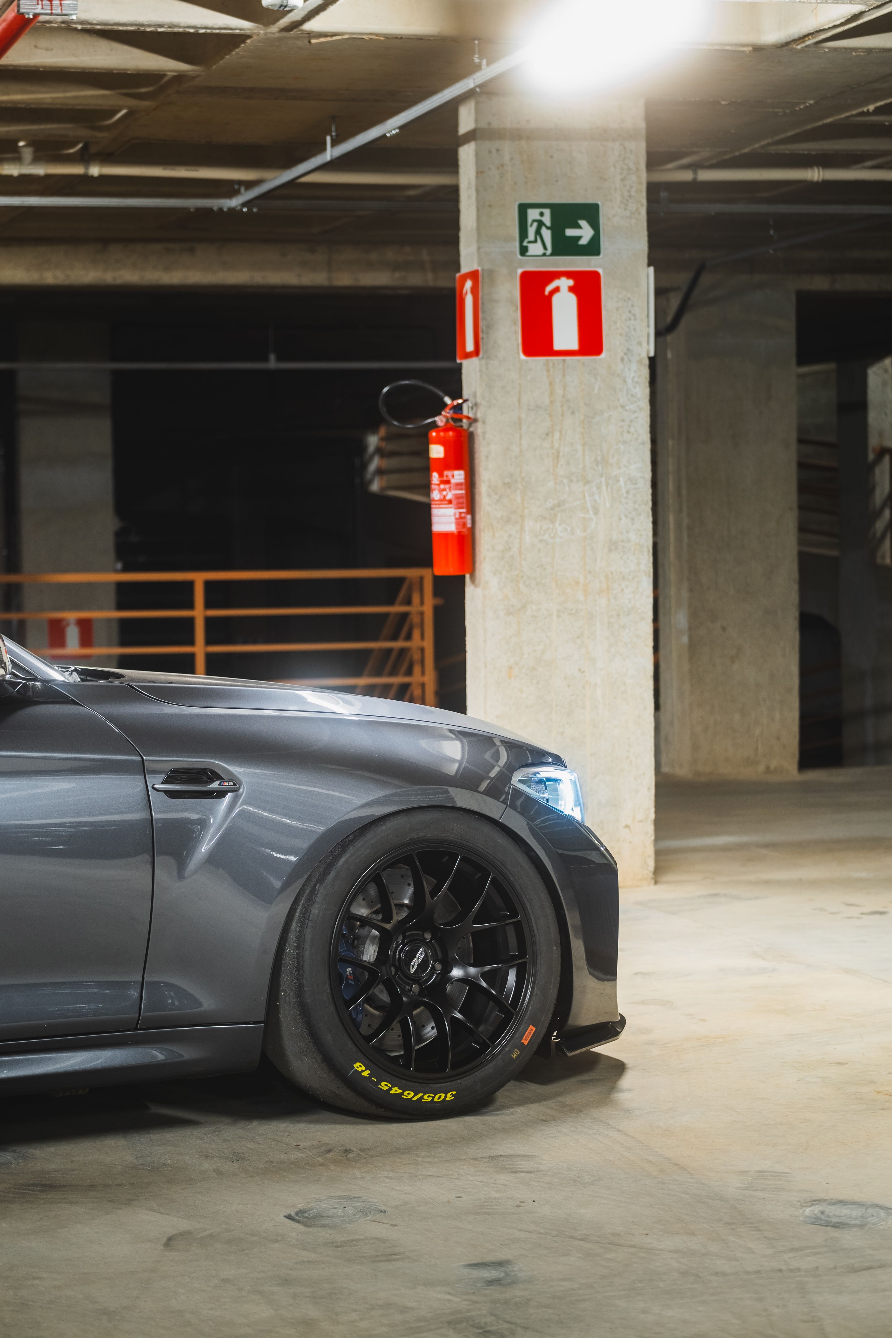 Black BMW F87 M2 with 18" EC-7 Apex wheels in Satin Black