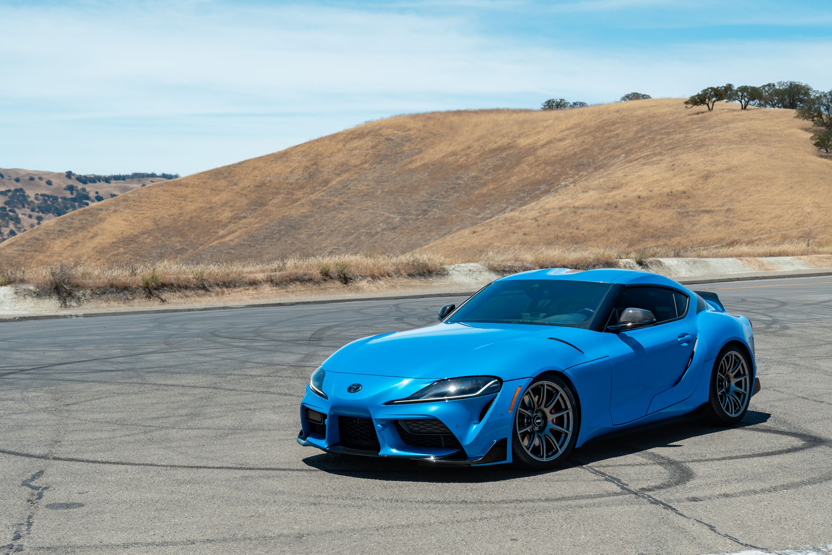 Blue Toyota GR Supra with 19" SM-10 Apex wheels in Anthracite
