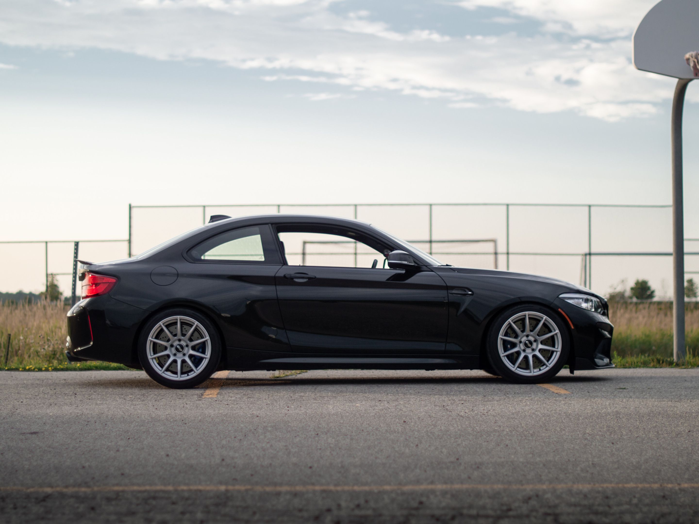 Black BMW F87 M2 with 18" SM-10 Apex wheels in Race Silver
