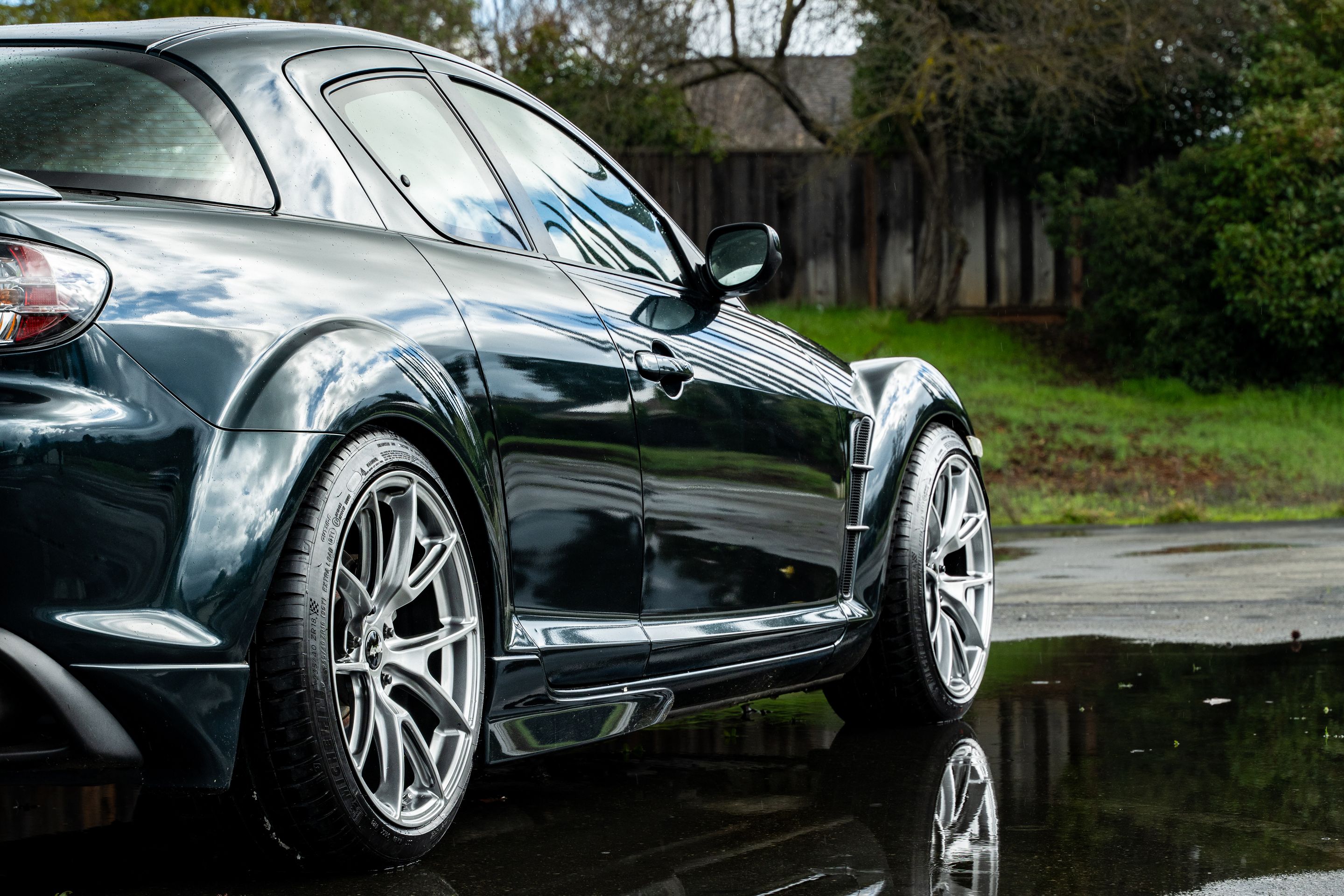 Green Mazda RX-8 with 18" VS-5 Apex wheels in Hyper Black