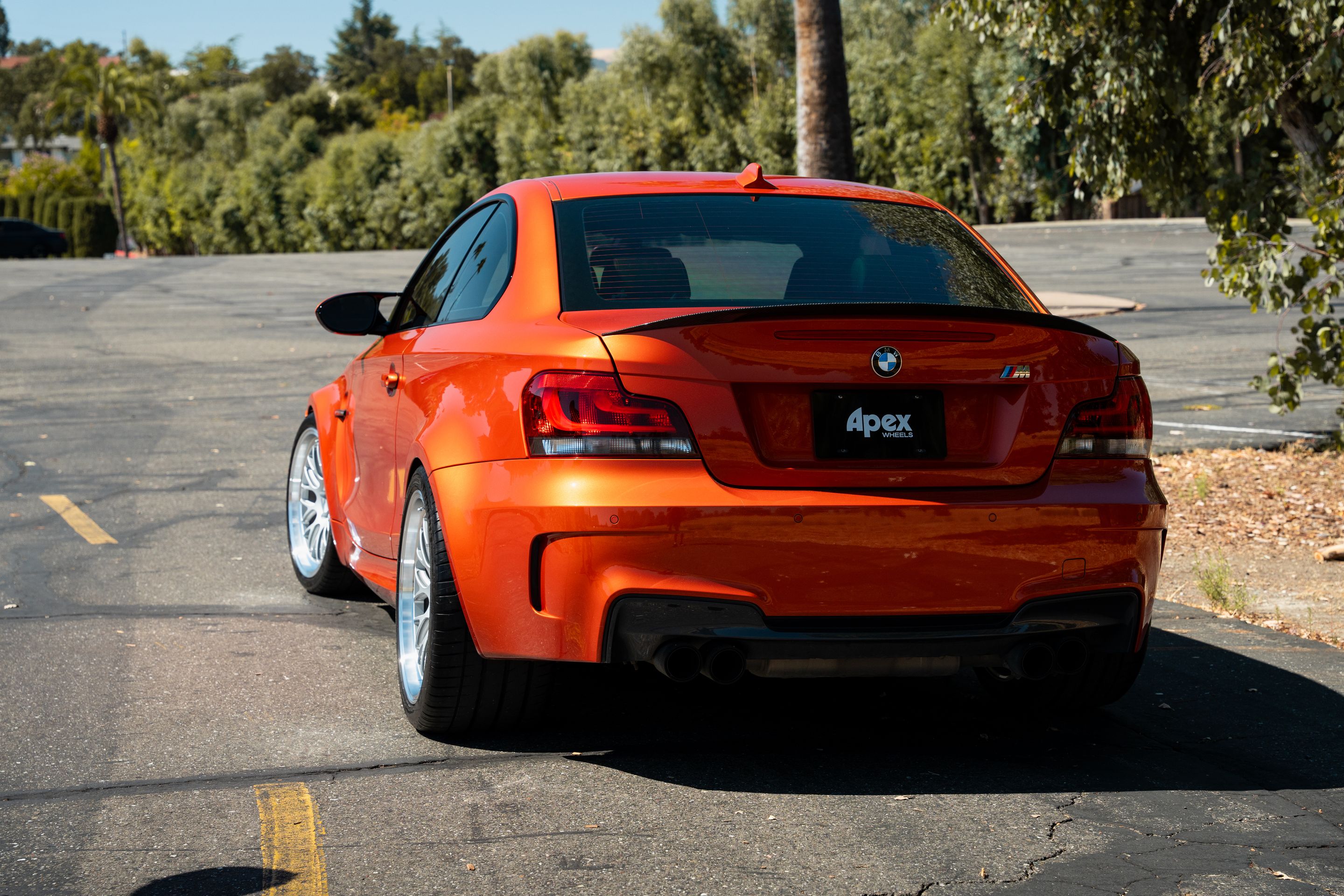 Orange BMW E82 1M with 19" ML-10RT Apex wheels in Machined Lip Race Silver