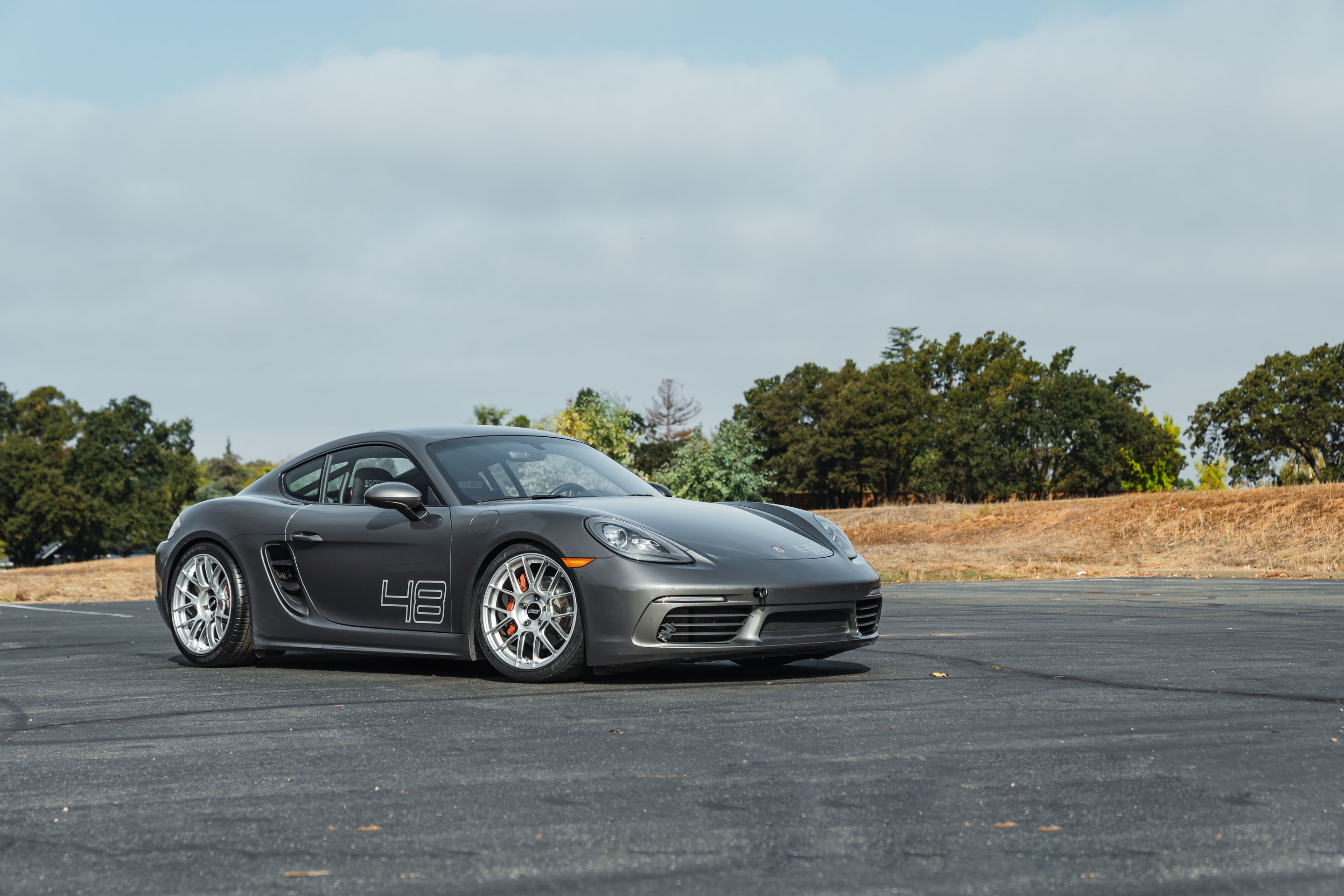 Grey Porsche 718 Cayman S with 19" EC-7RS Apex wheels in Race Silver