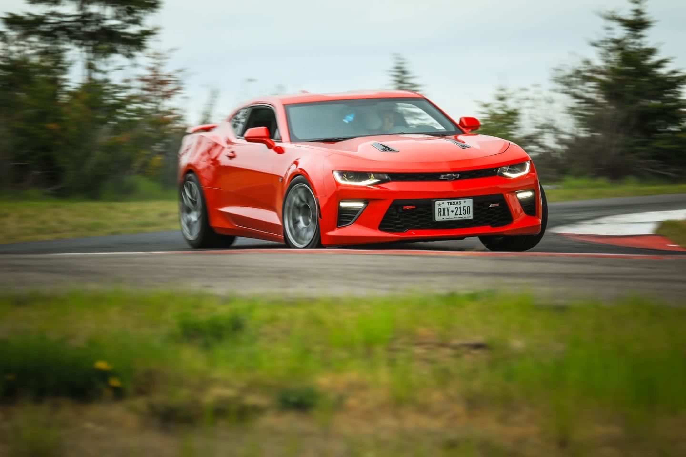Red Chevrolet 6th Gen Camaro SS with 18" EC-7RS Apex wheels in Brushed Clear