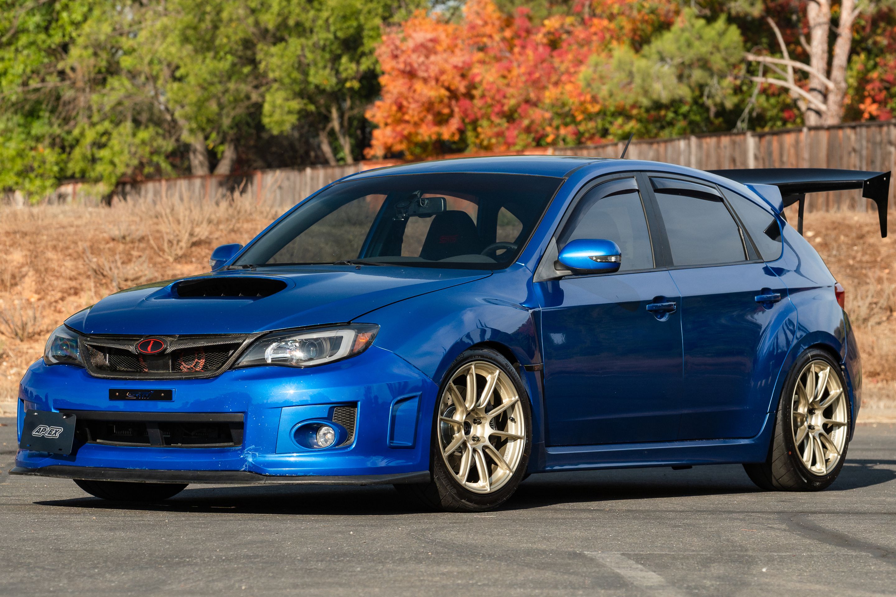 Blue Subaru GR WRX STI with 18" SM-10RS Apex wheels in Motorsport Gold