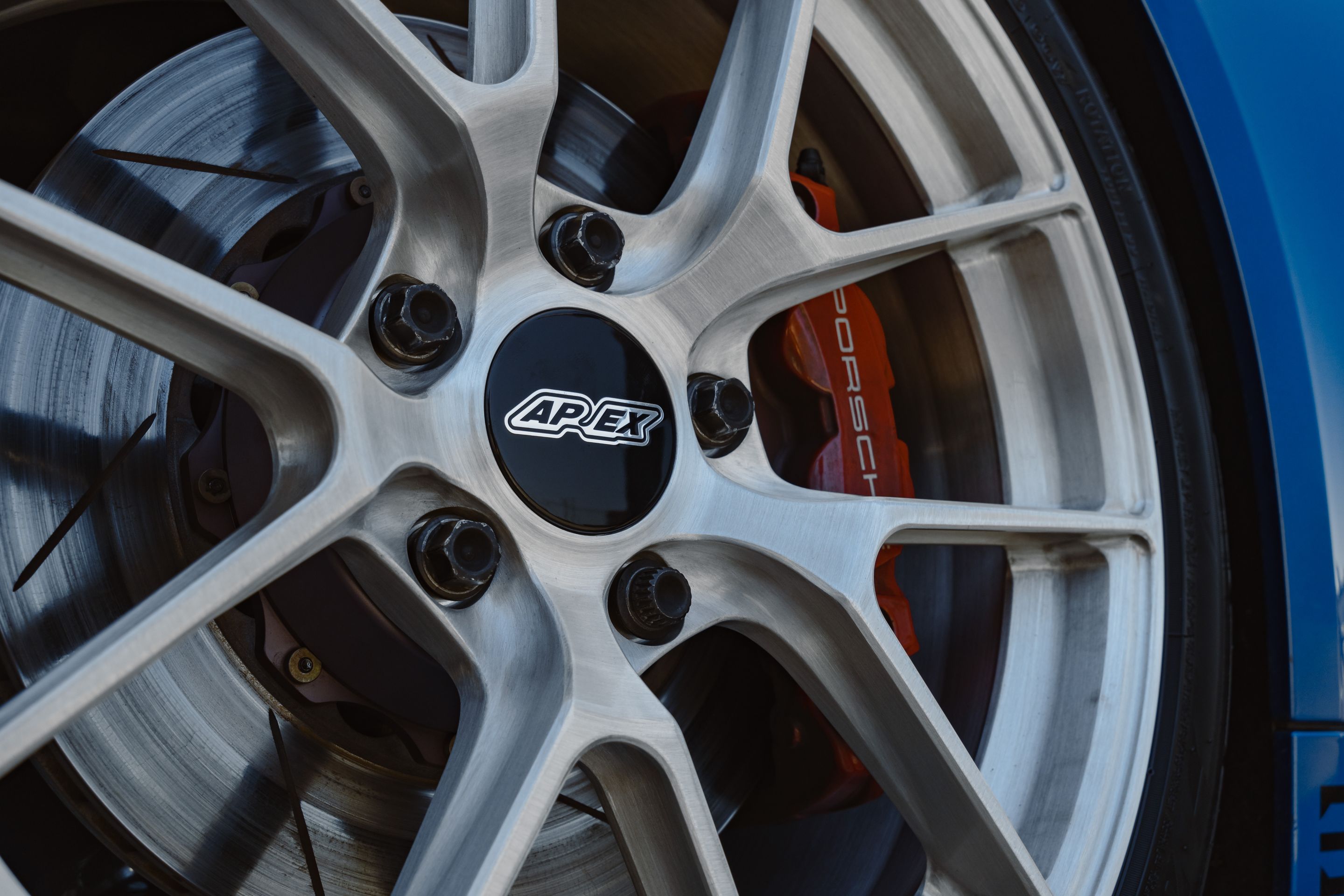 Blue Porsche 718 Cayman GTS 2.5L with 19" VS-5RS Apex wheels in Brushed Clear