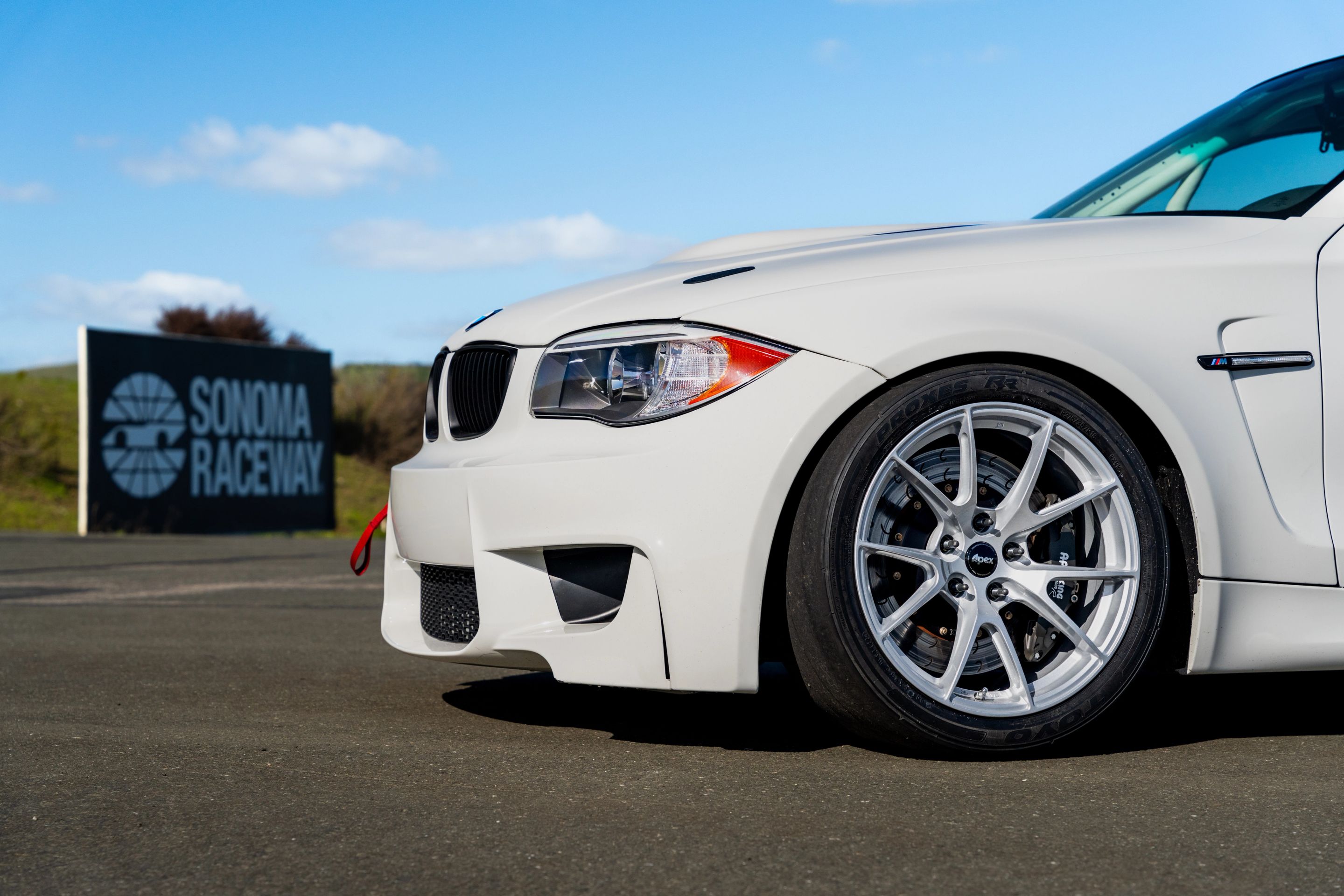 White BMW E82 1M with 18" VS-5 Apex wheels in Race Silver